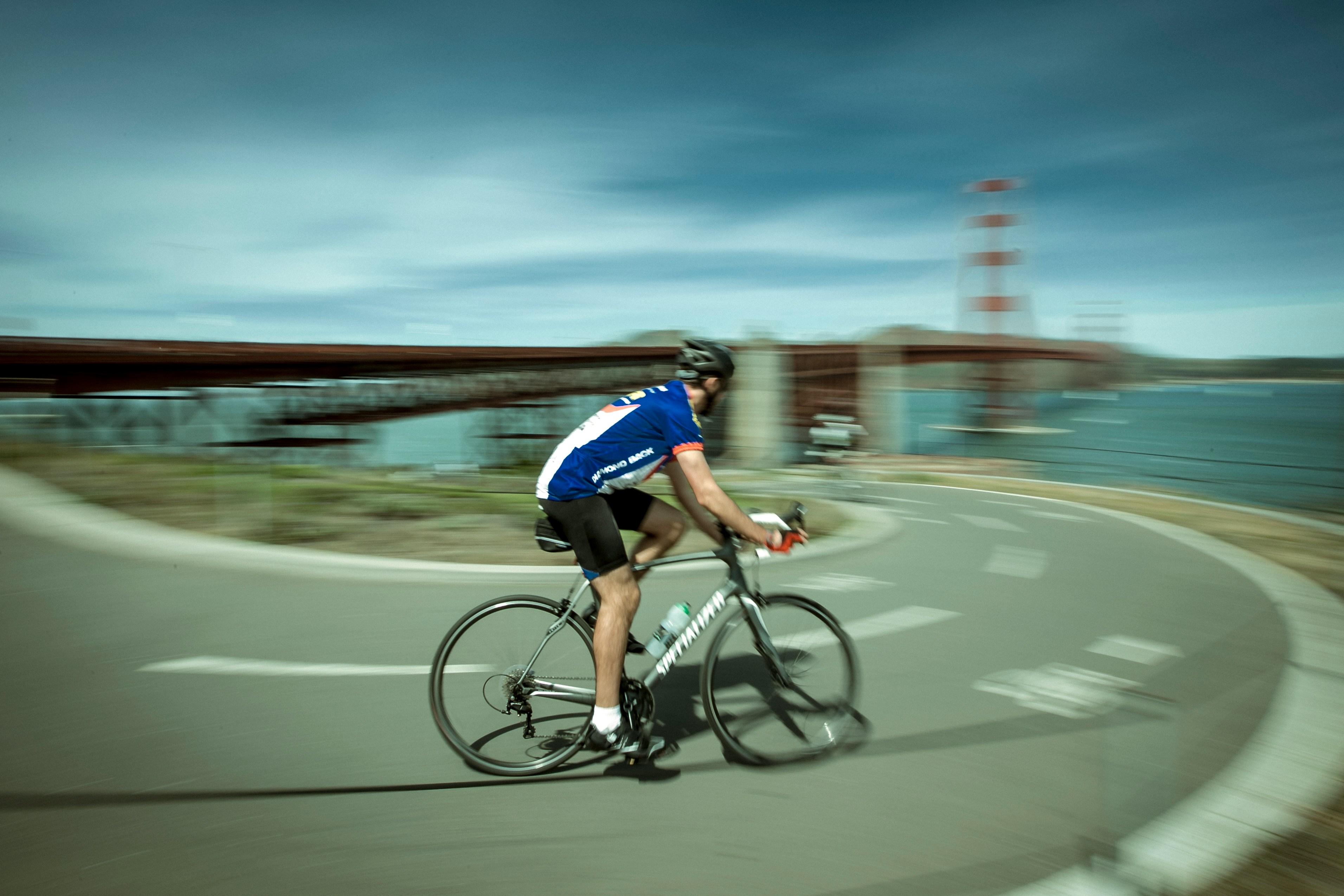 Cyclist riding a road bike outdoors in real conditions.