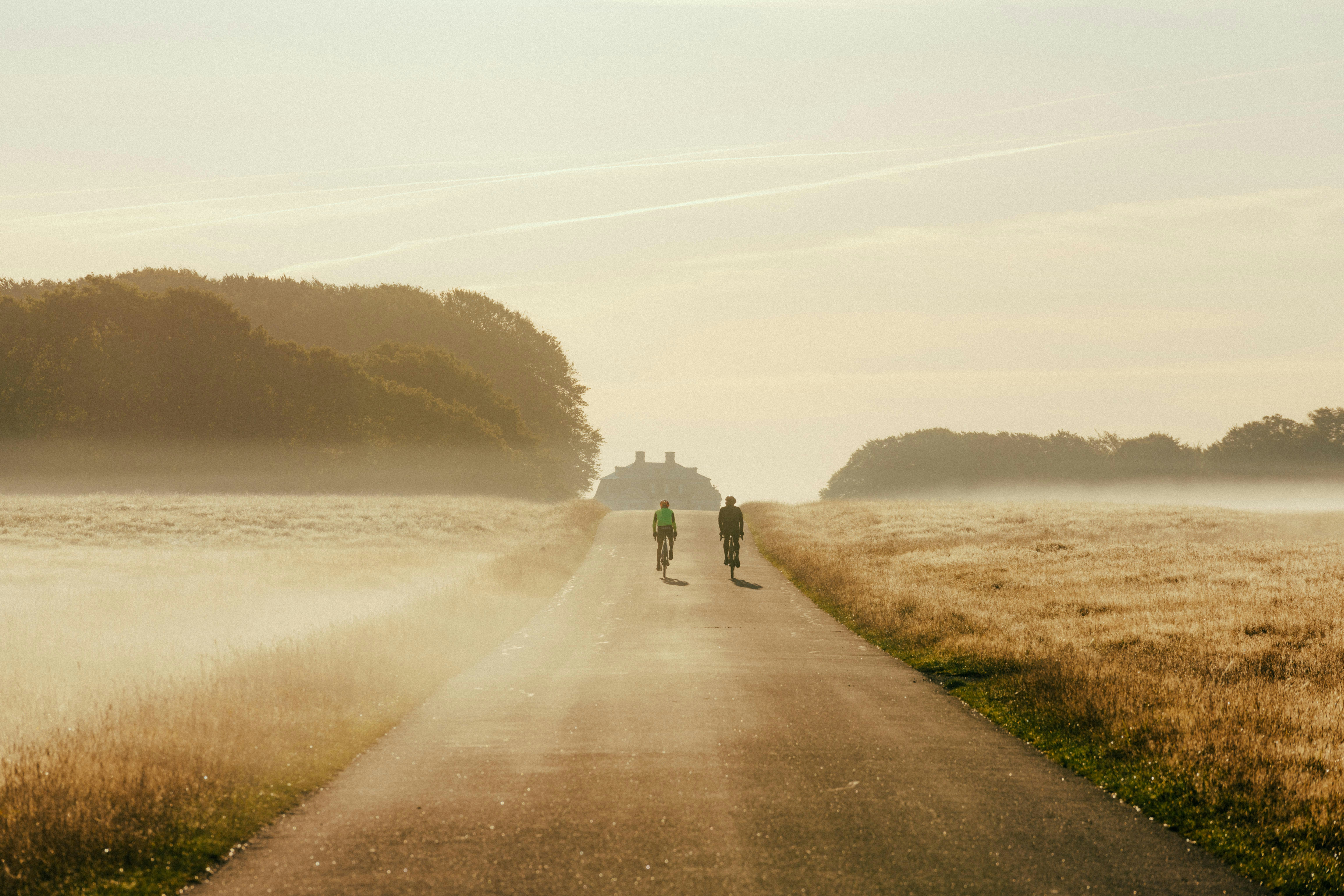 Cyclist riding a road bike outdoors in real conditions.