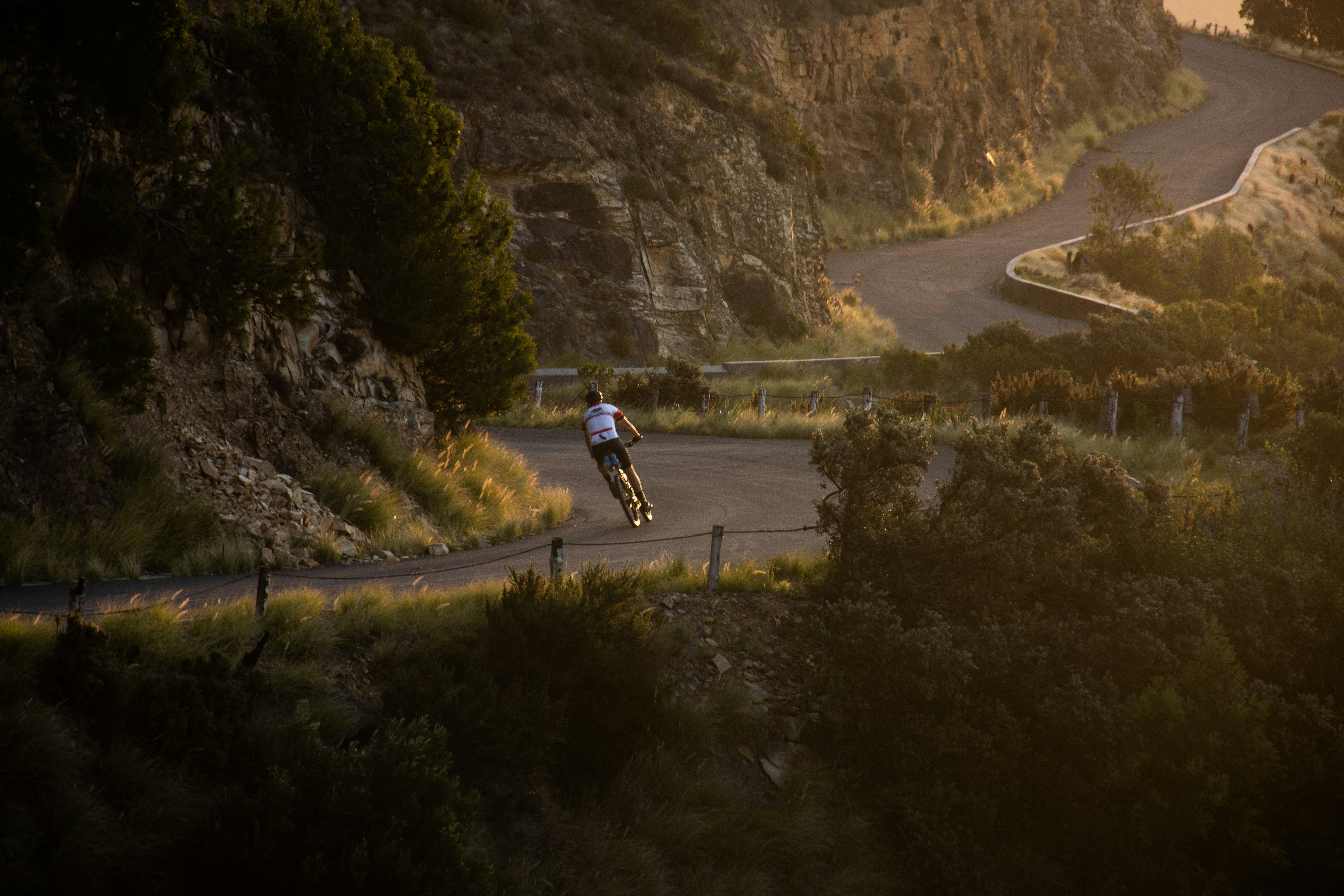 Cyclist riding a road bike outdoors in real conditions.