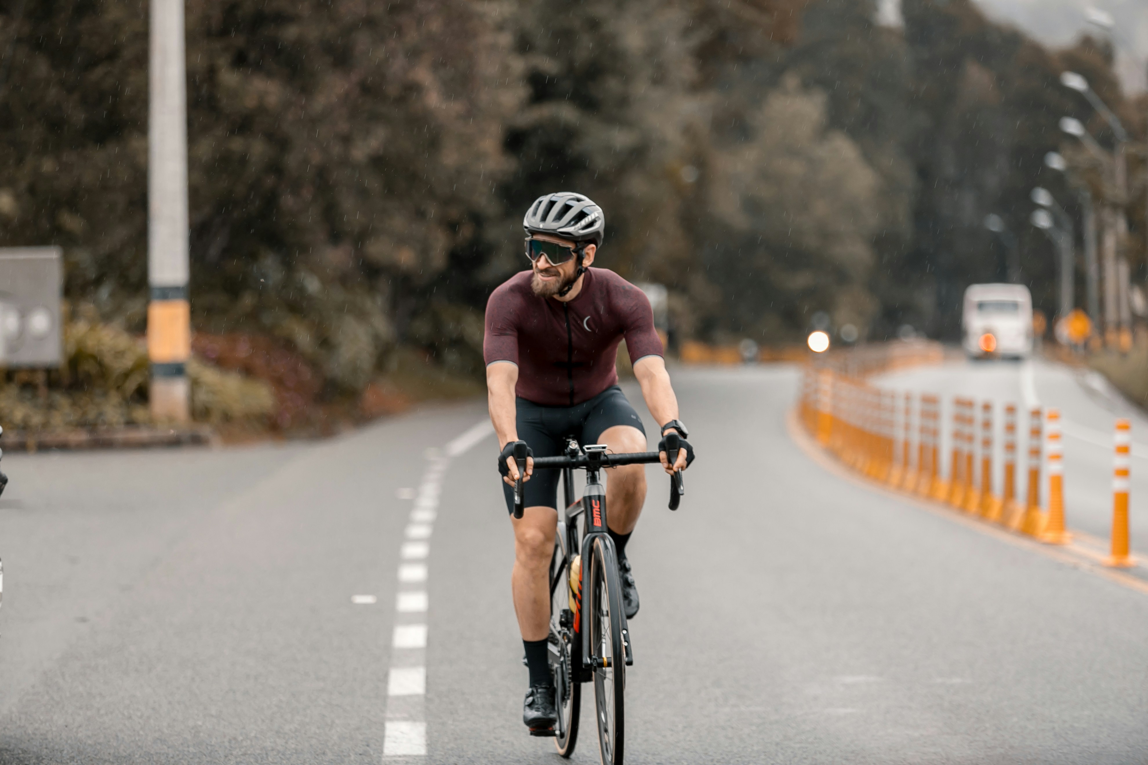Cyclist riding a road bike outdoors in real conditions.