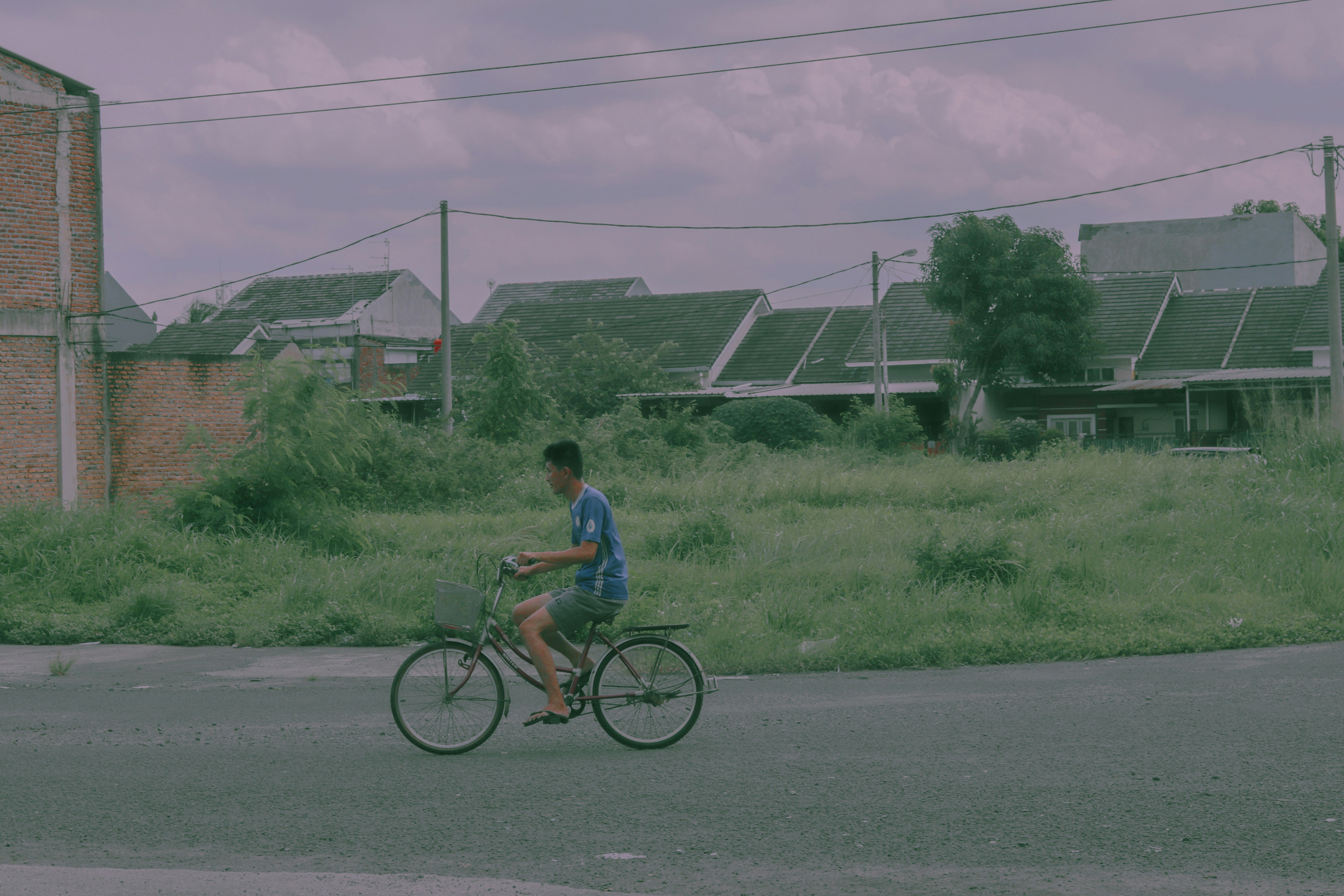 Cyclist riding a road bike outdoors in real conditions.
