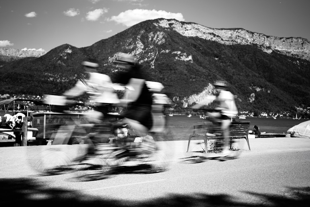 Group of road cyclists riding together outdoors on paved roads.