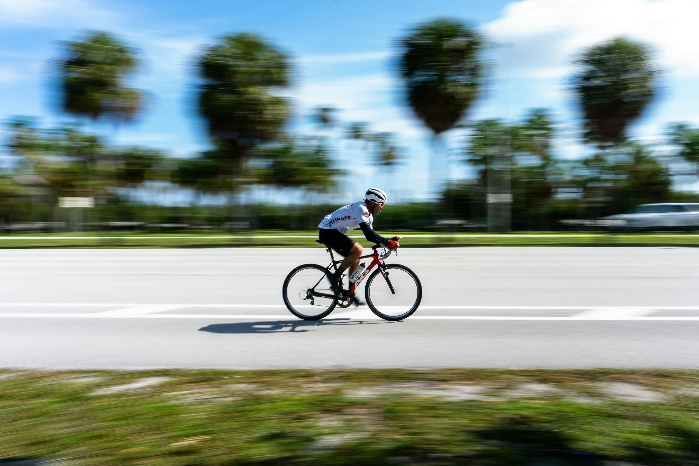 Cyclist riding a road bike outdoors in real conditions.