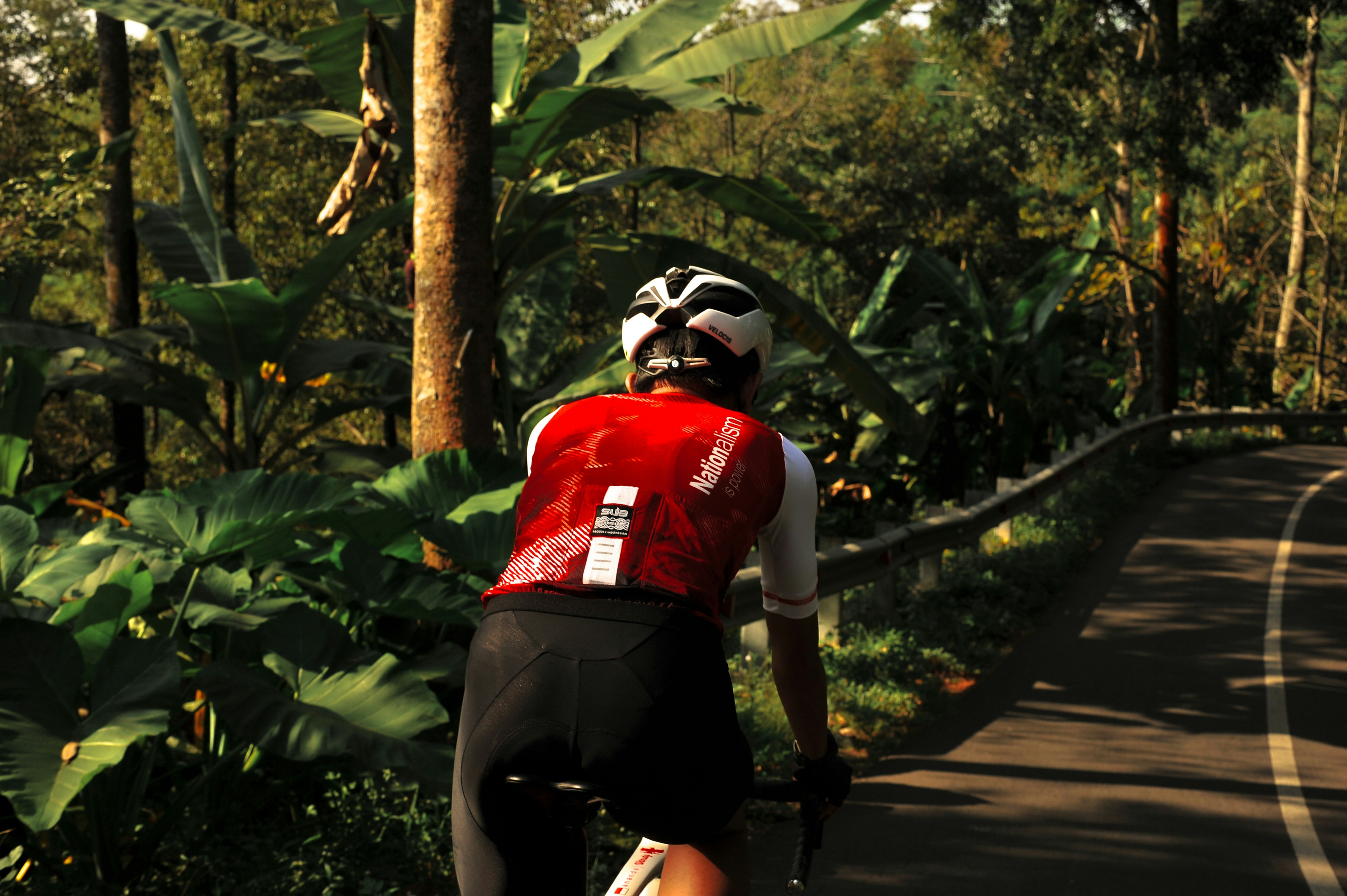 Cyclist riding a road bike outdoors in real conditions.