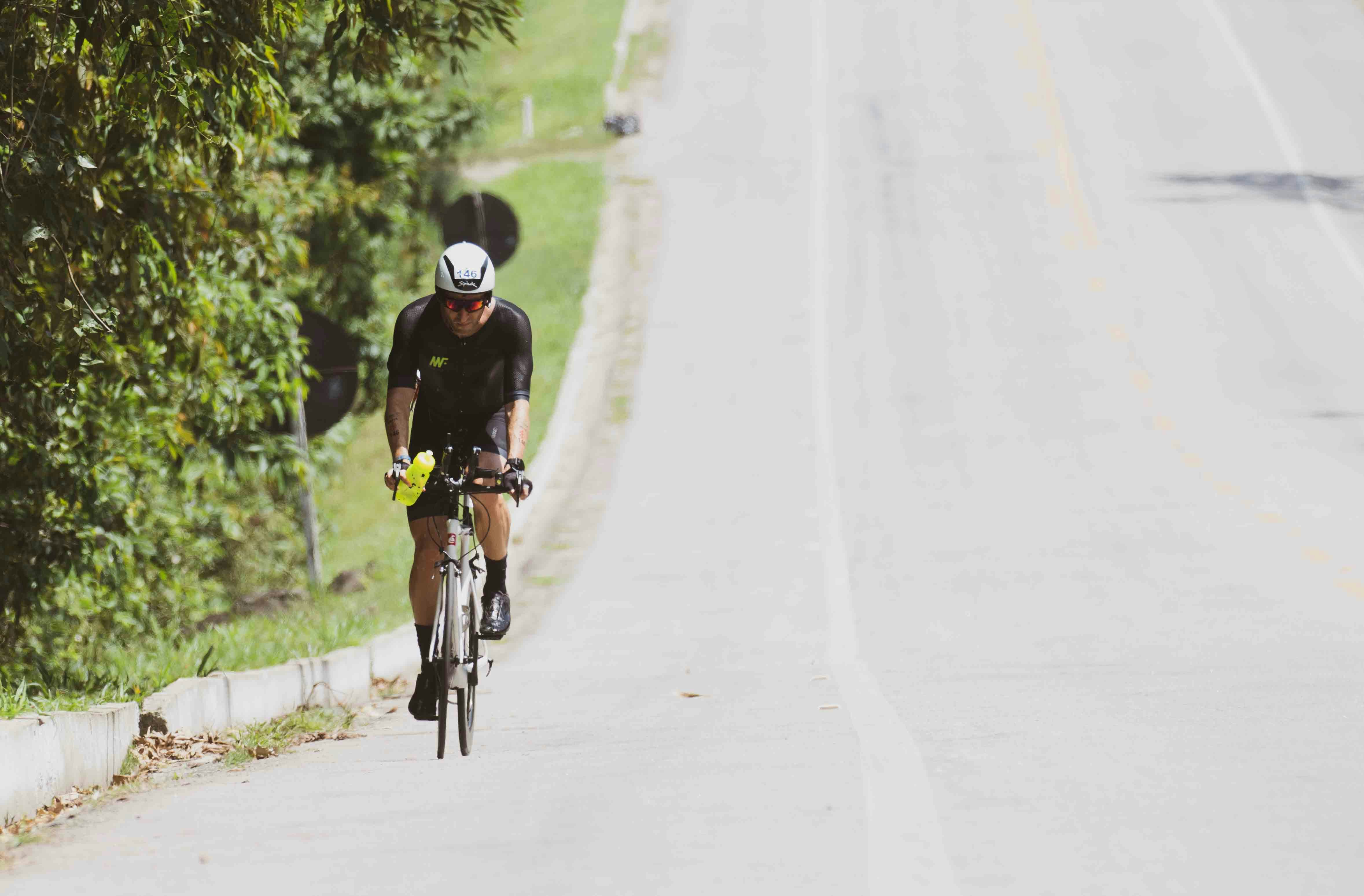 Cyclist riding a road bike outdoors in real conditions.
