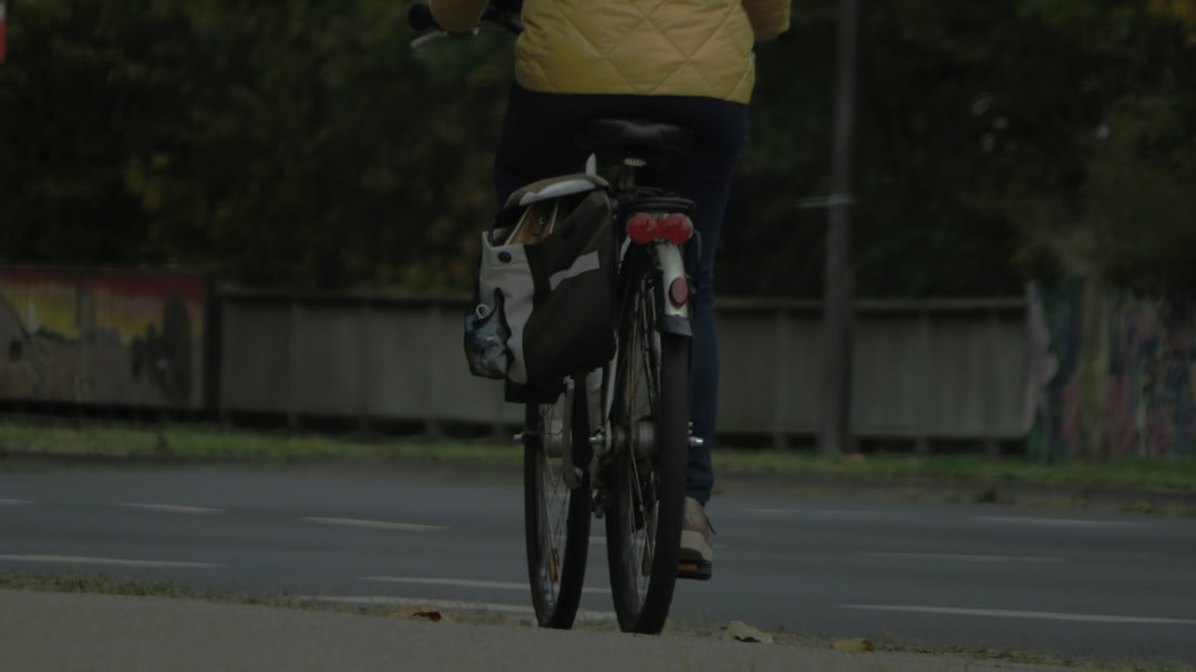 Group of road cyclists riding together outdoors on paved roads.