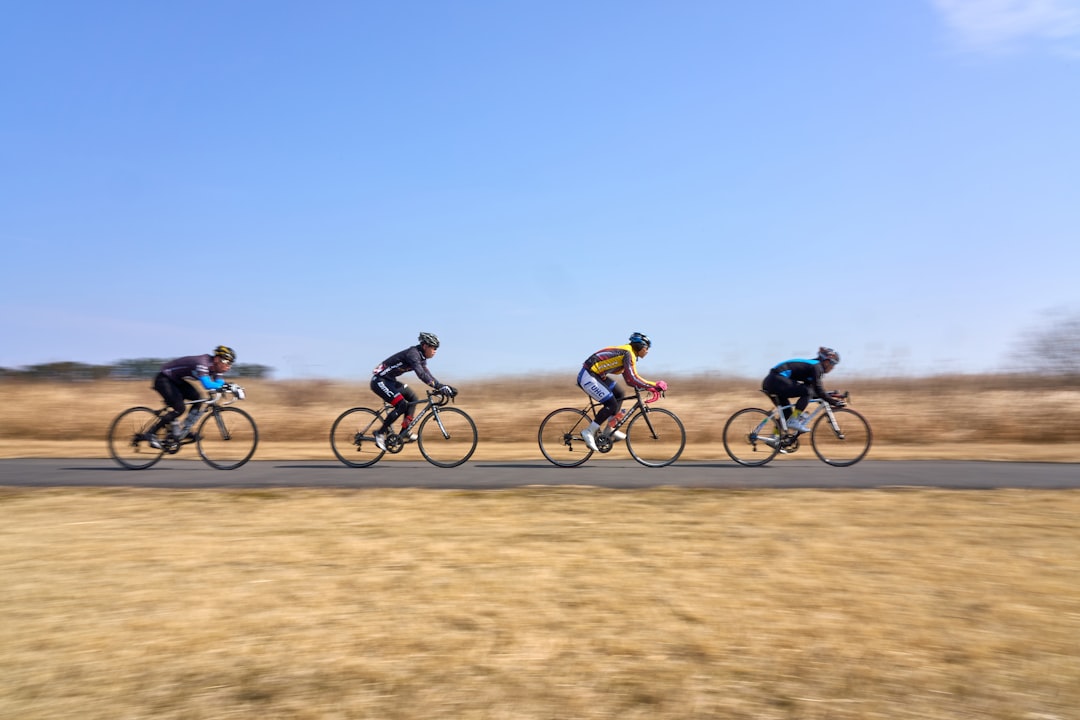 Group of cyclists on an endurance ride in morning light.