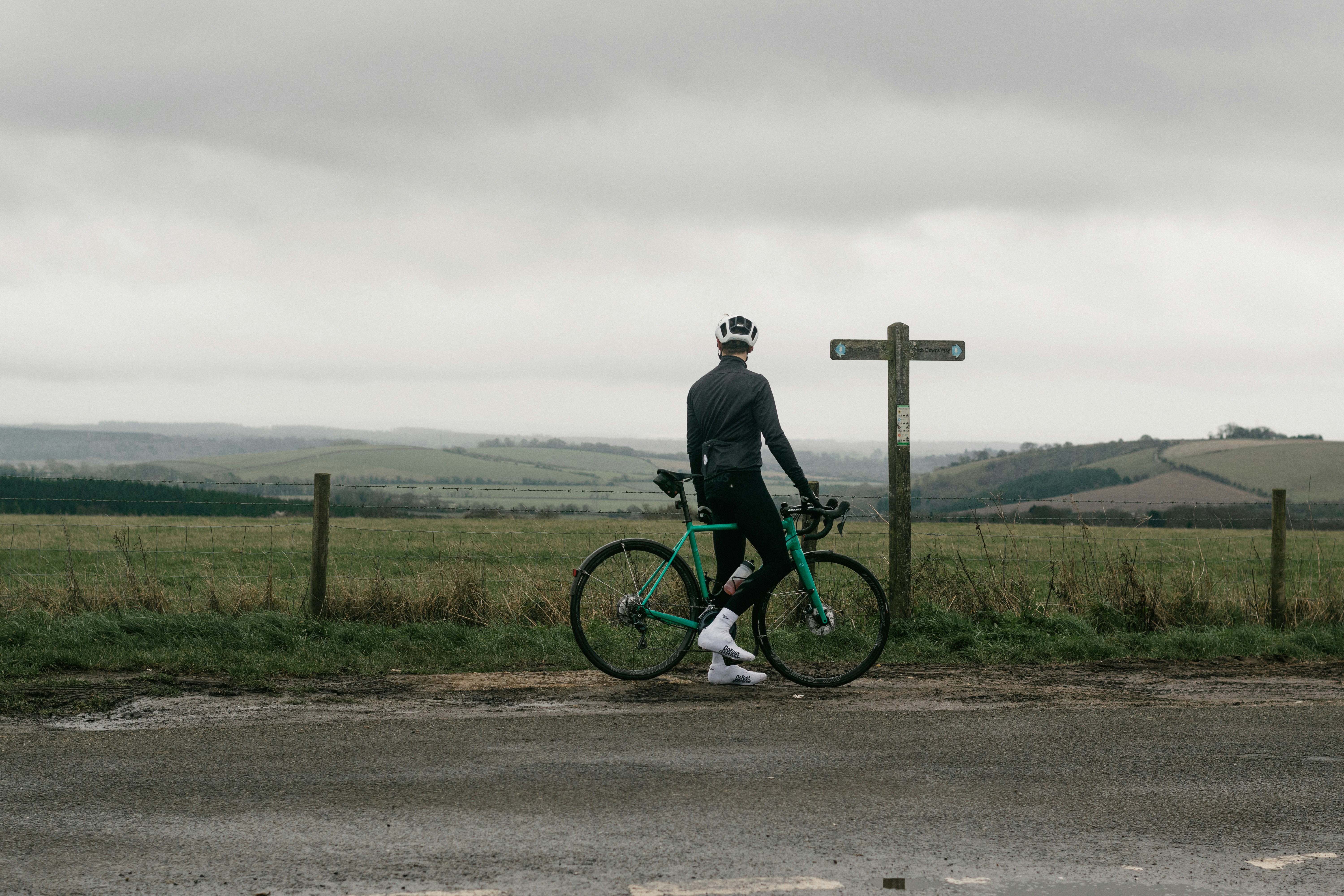 Cyclist riding a road bike outdoors in real conditions.