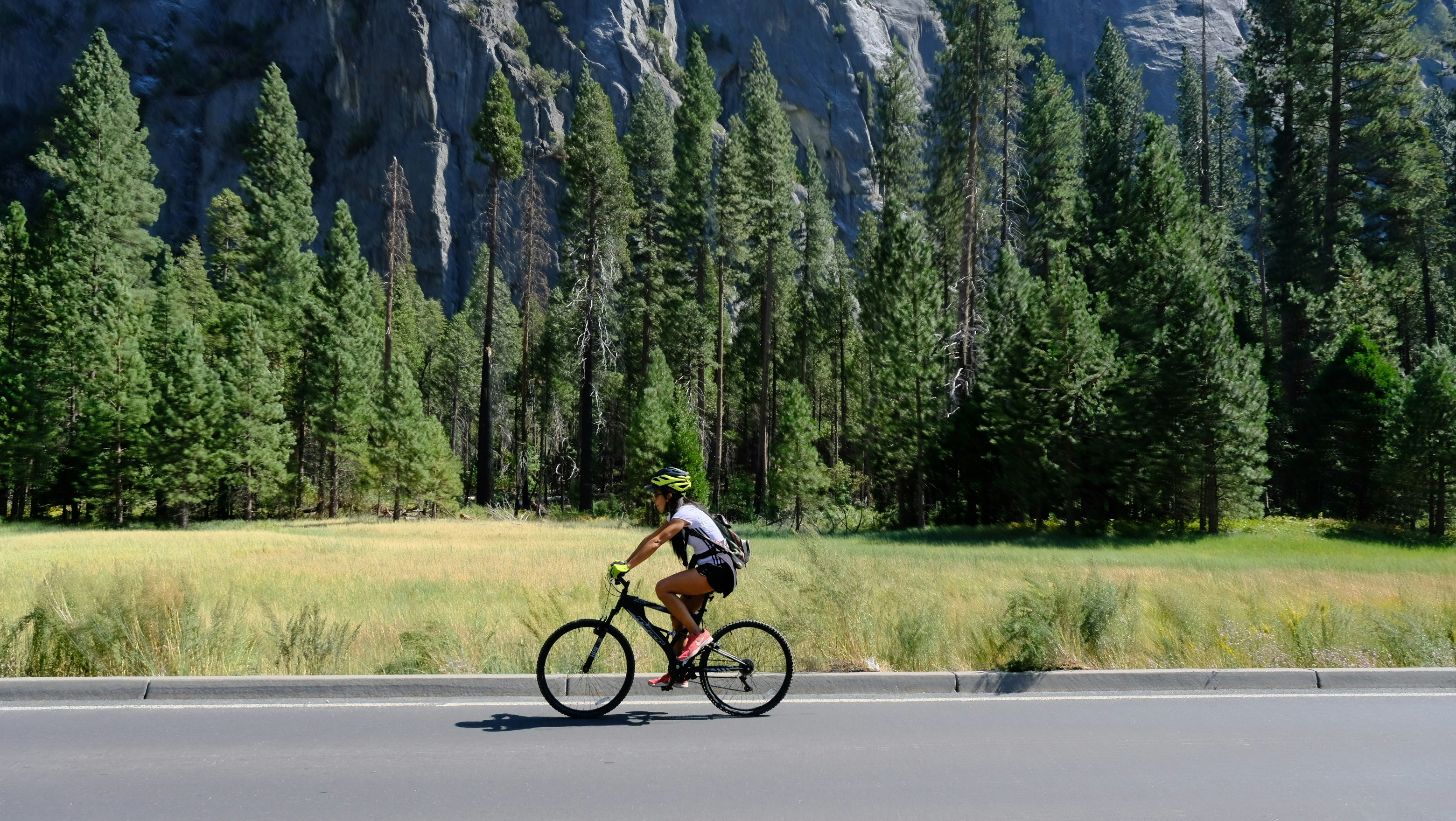 Cyclist riding a road bike outdoors in real conditions.