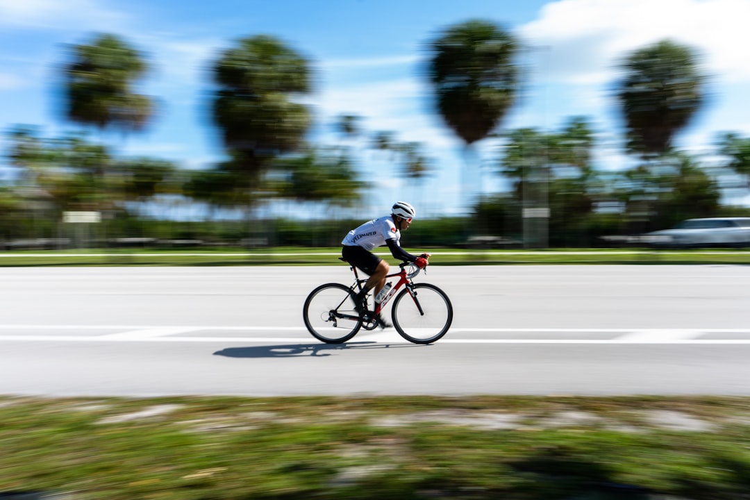 Group of road cyclists riding together outdoors on paved roads.