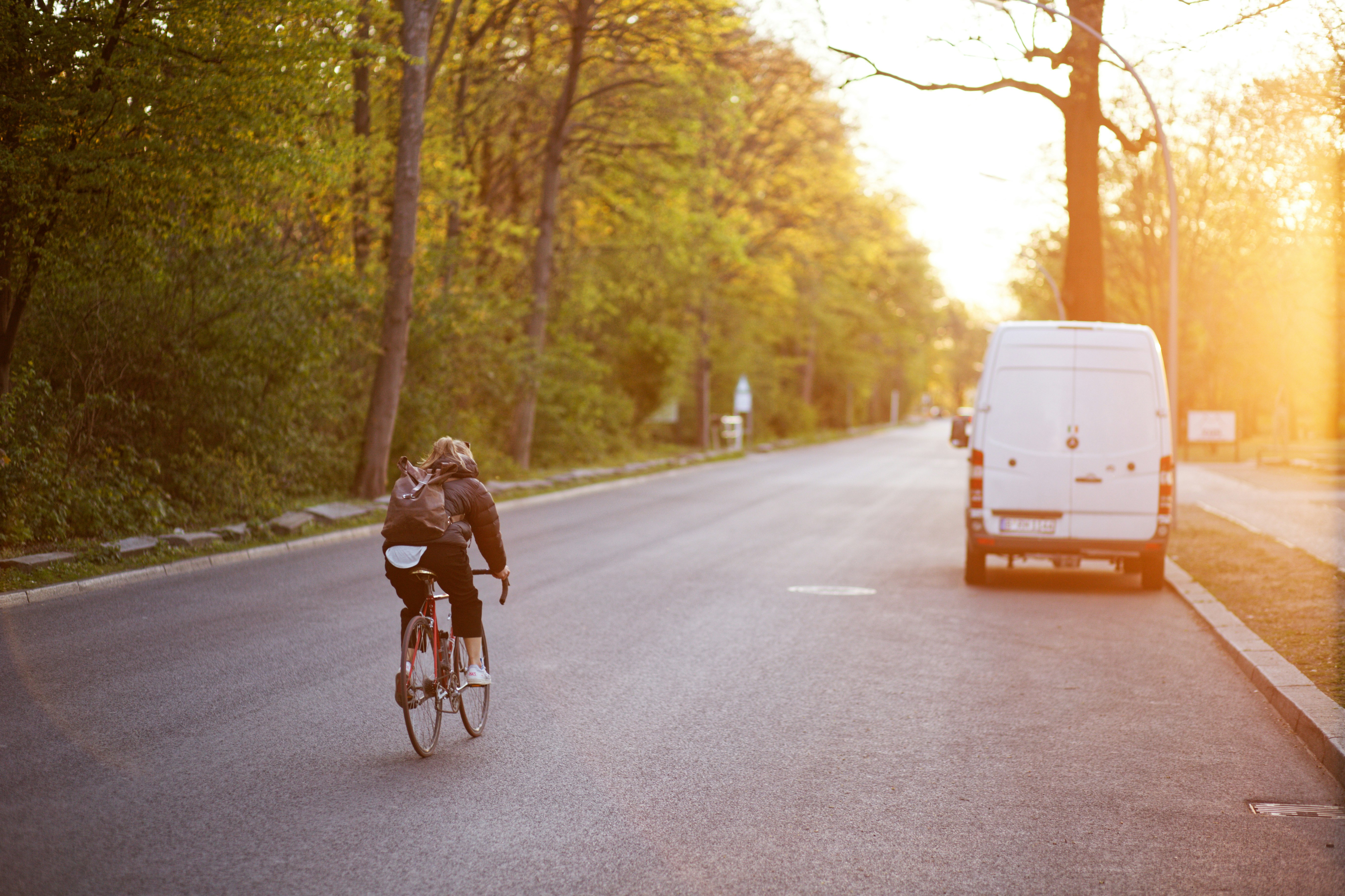 Cyclist riding a road bike outdoors in real conditions.