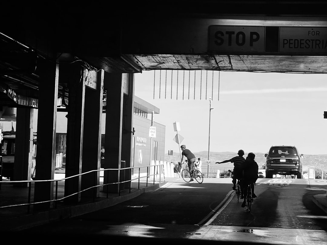 Group of road cyclists riding together outdoors on paved roads.