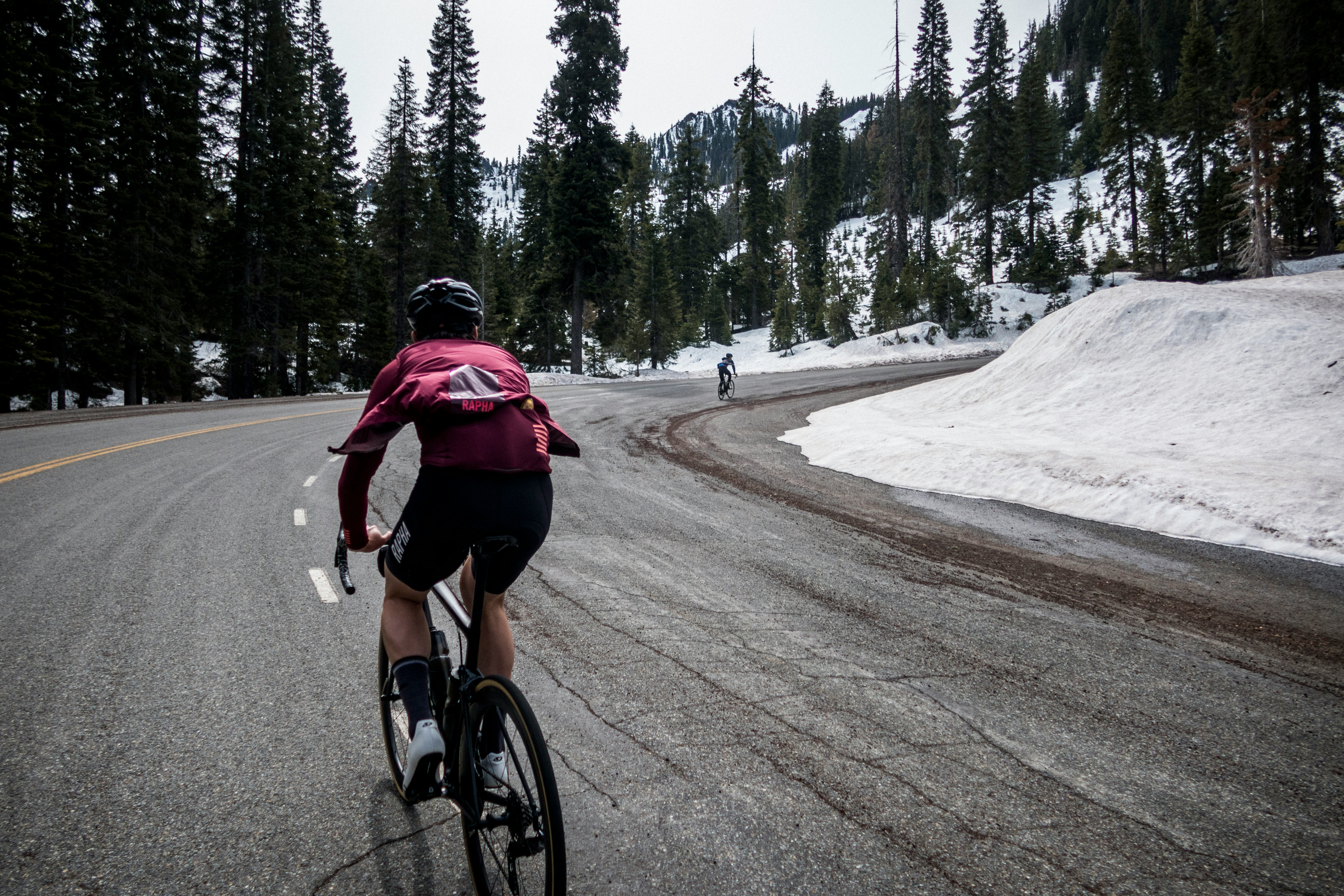 Cyclist riding a road bike outdoors in real conditions.