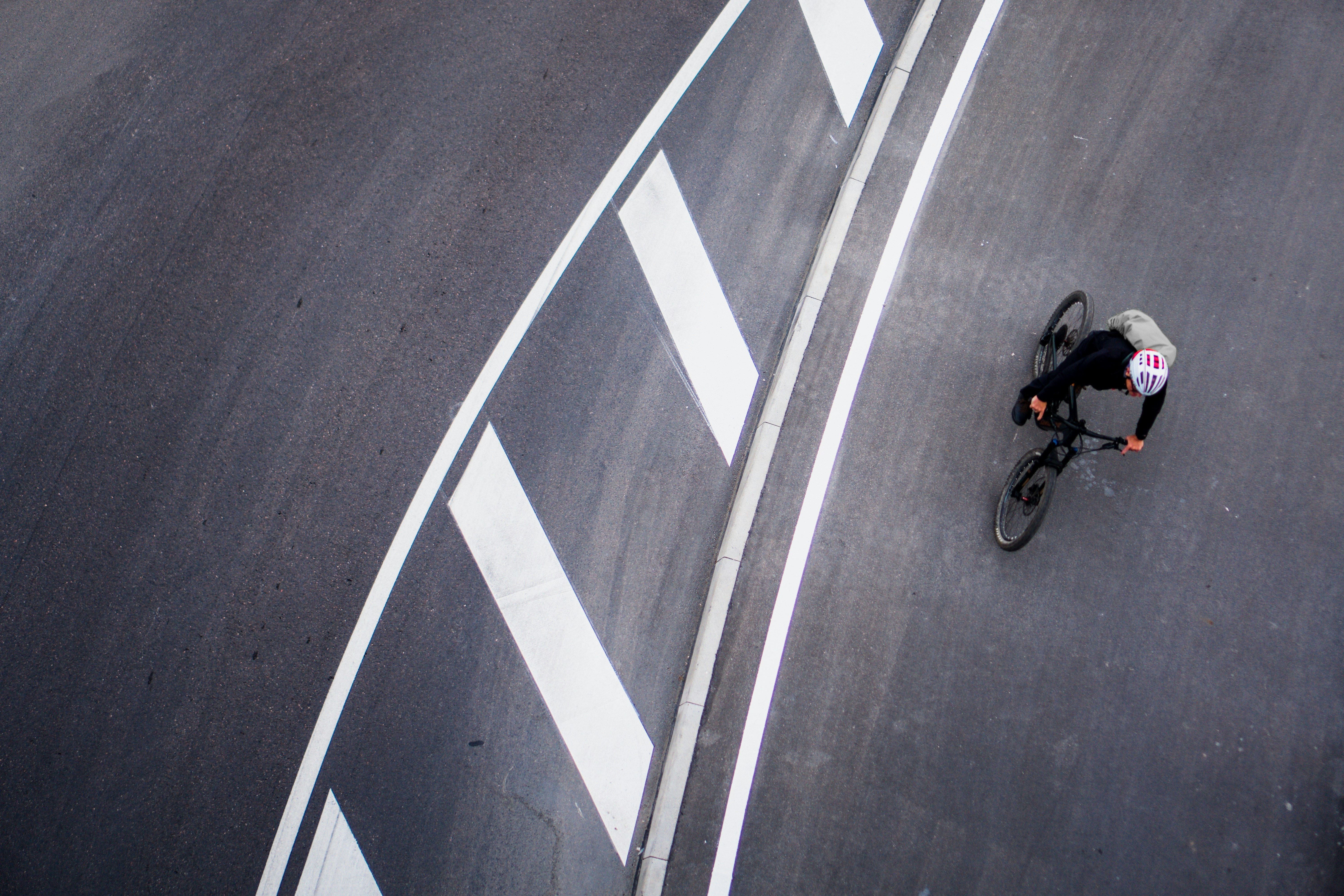 Cyclist riding a road bike outdoors in real conditions.