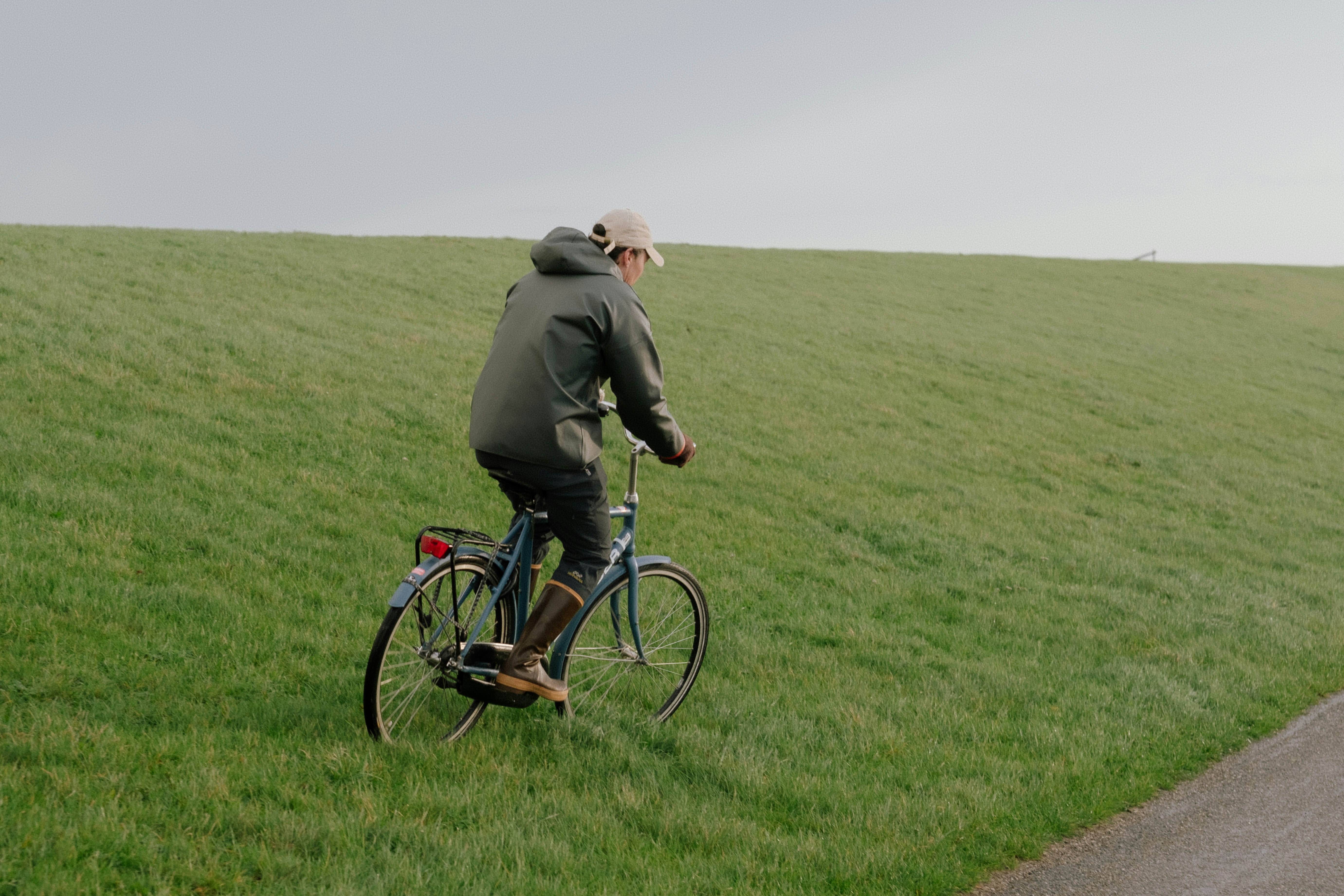 Cyclist riding a road bike outdoors in real conditions.