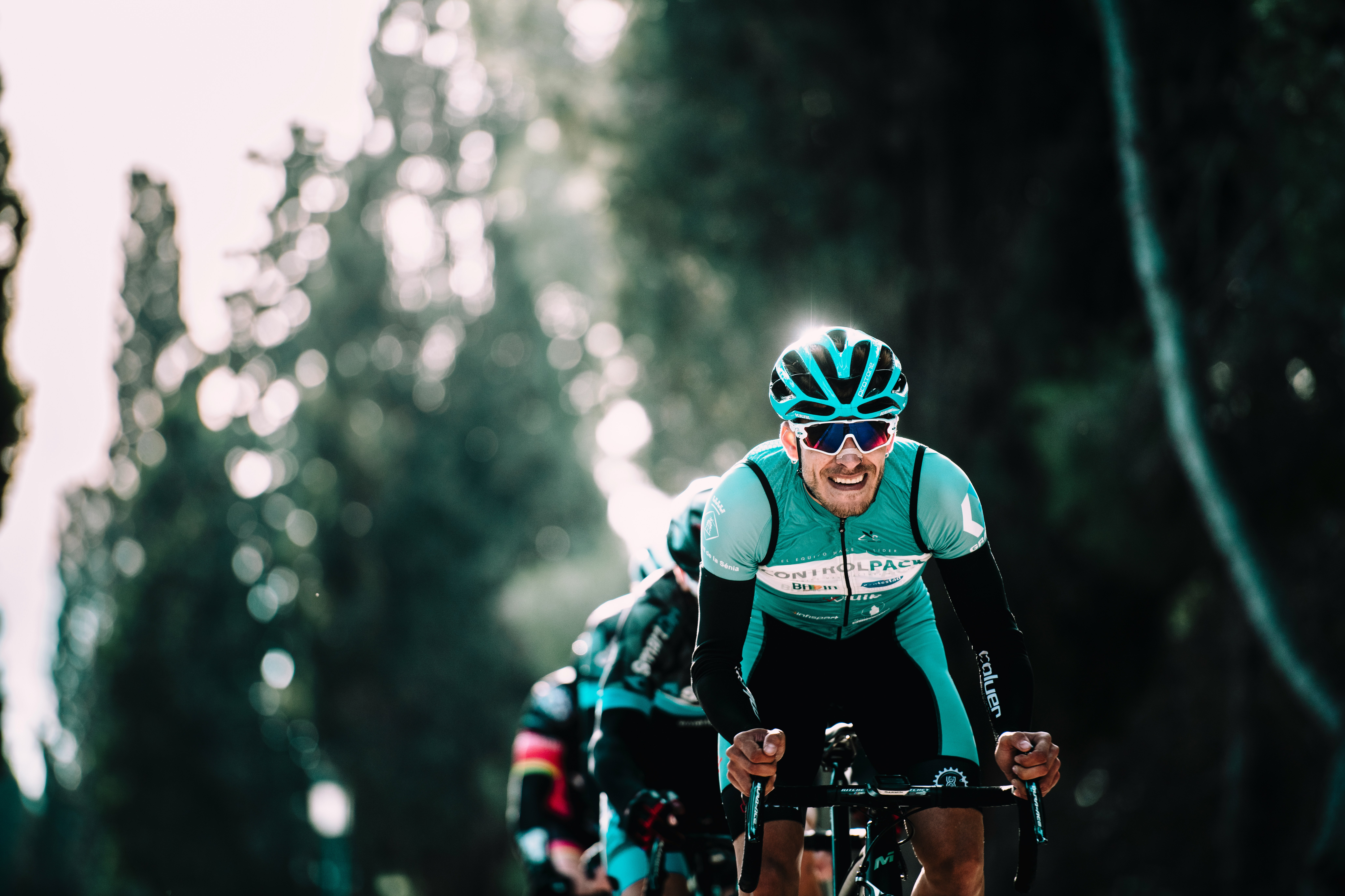 Cyclist riding a road bike outdoors in real conditions.
