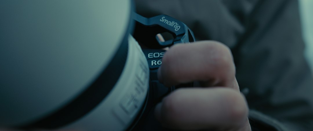 Close-up of a cyclist pedaling on a road bike with a power meter visible.