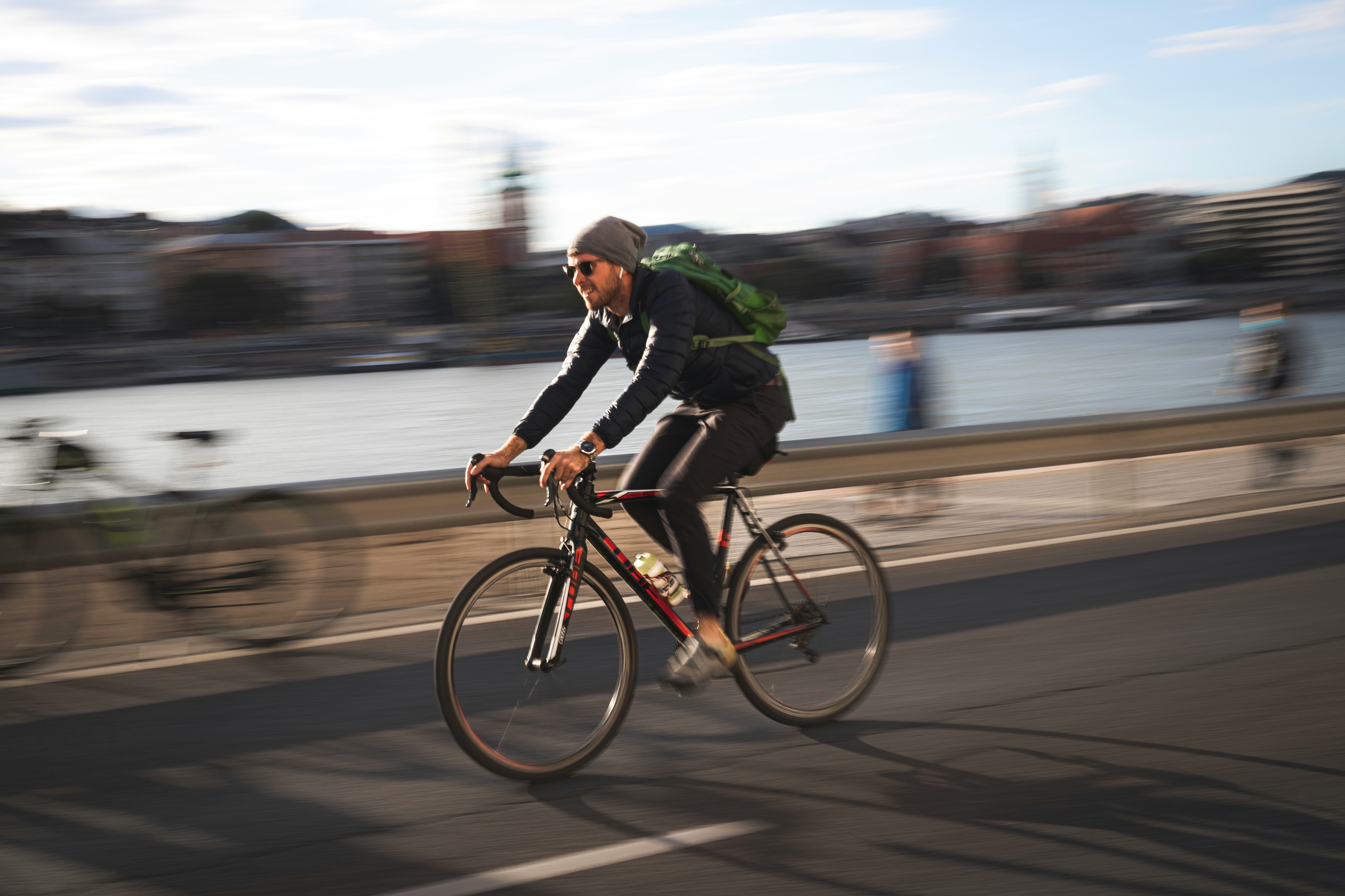 Cyclist riding a road bike outdoors in real conditions.