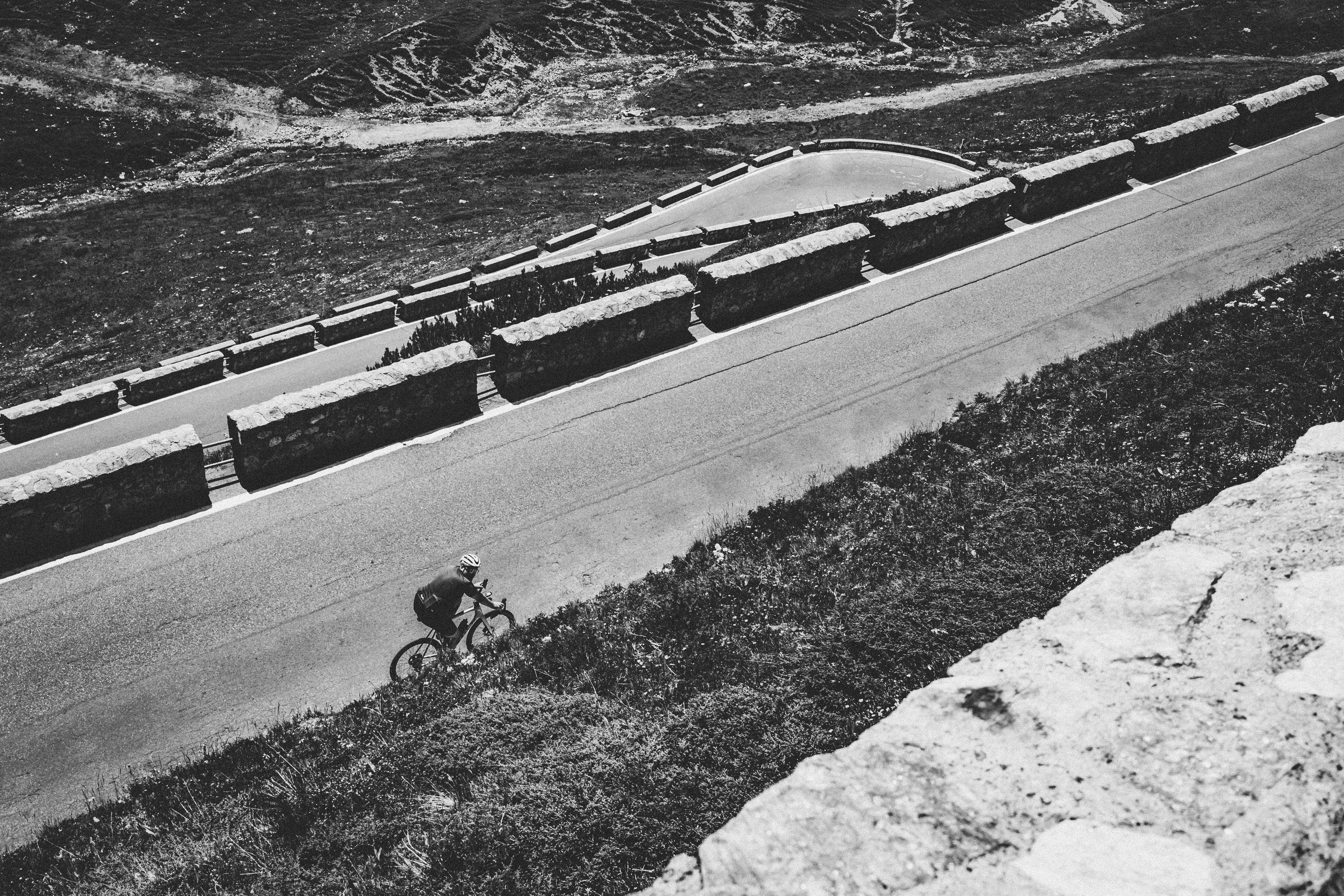 Cyclist riding a road bike outdoors in real conditions.