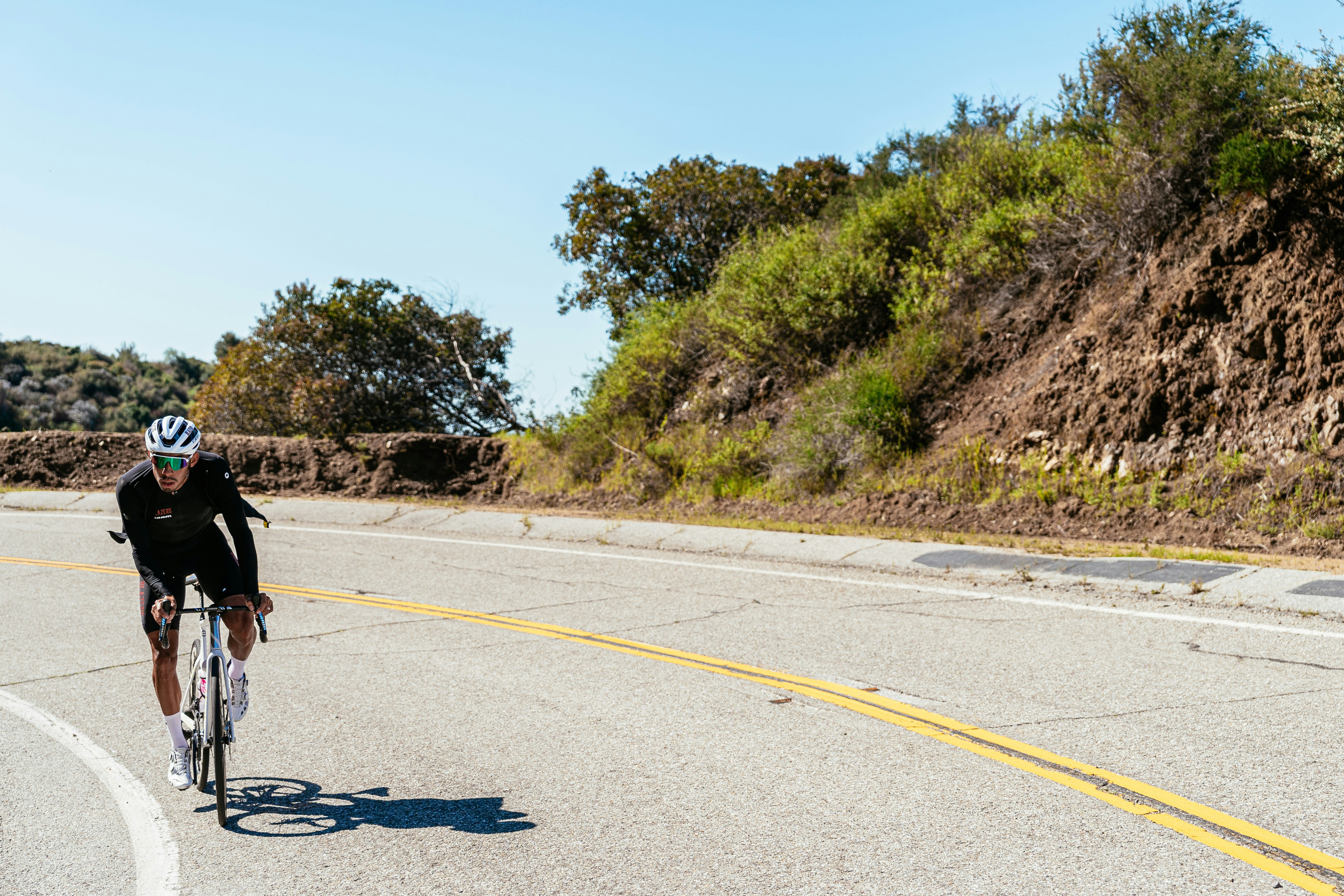 Cyclist riding a road bike outdoors in real conditions.