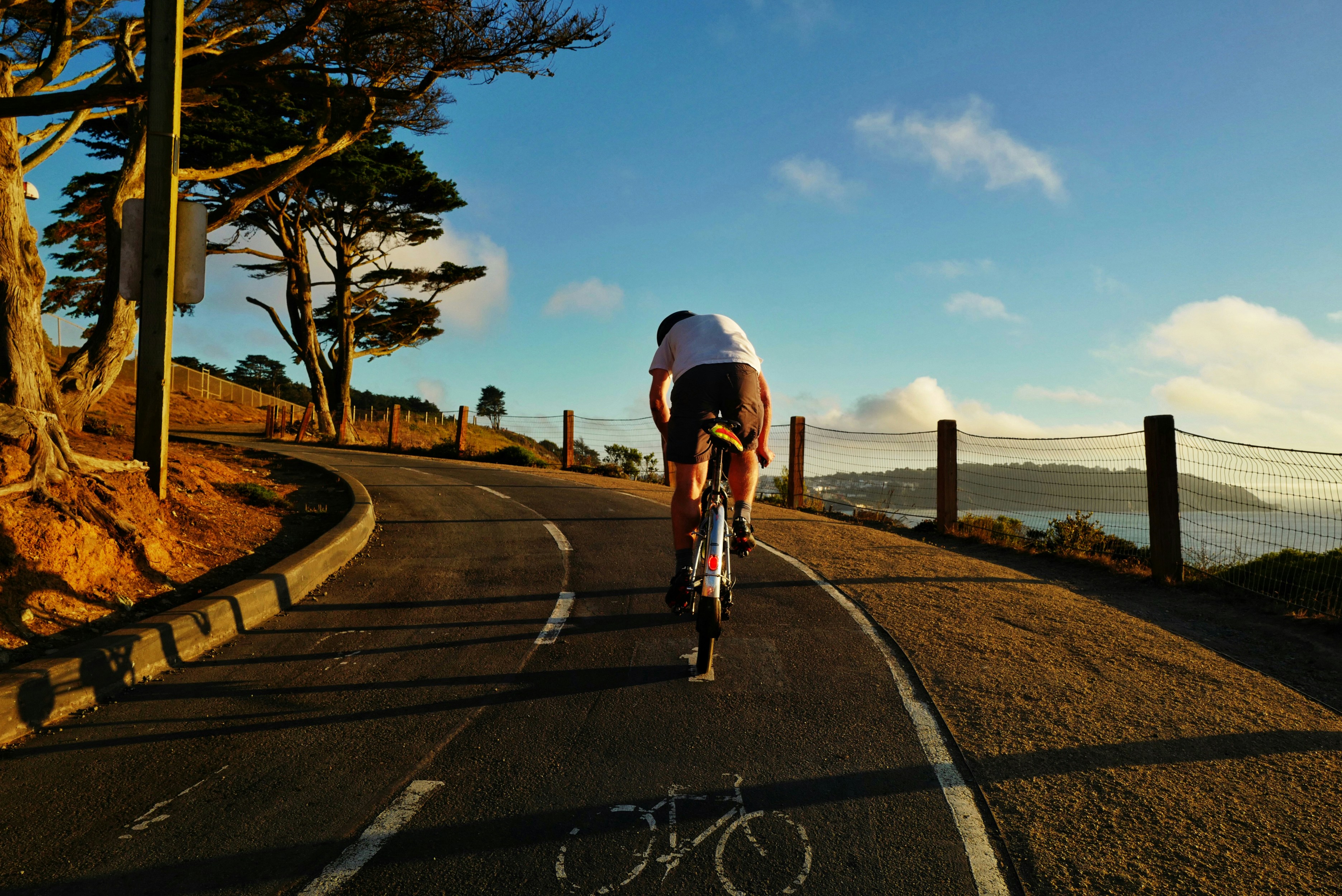 Cyclist riding a road bike outdoors in real conditions.
