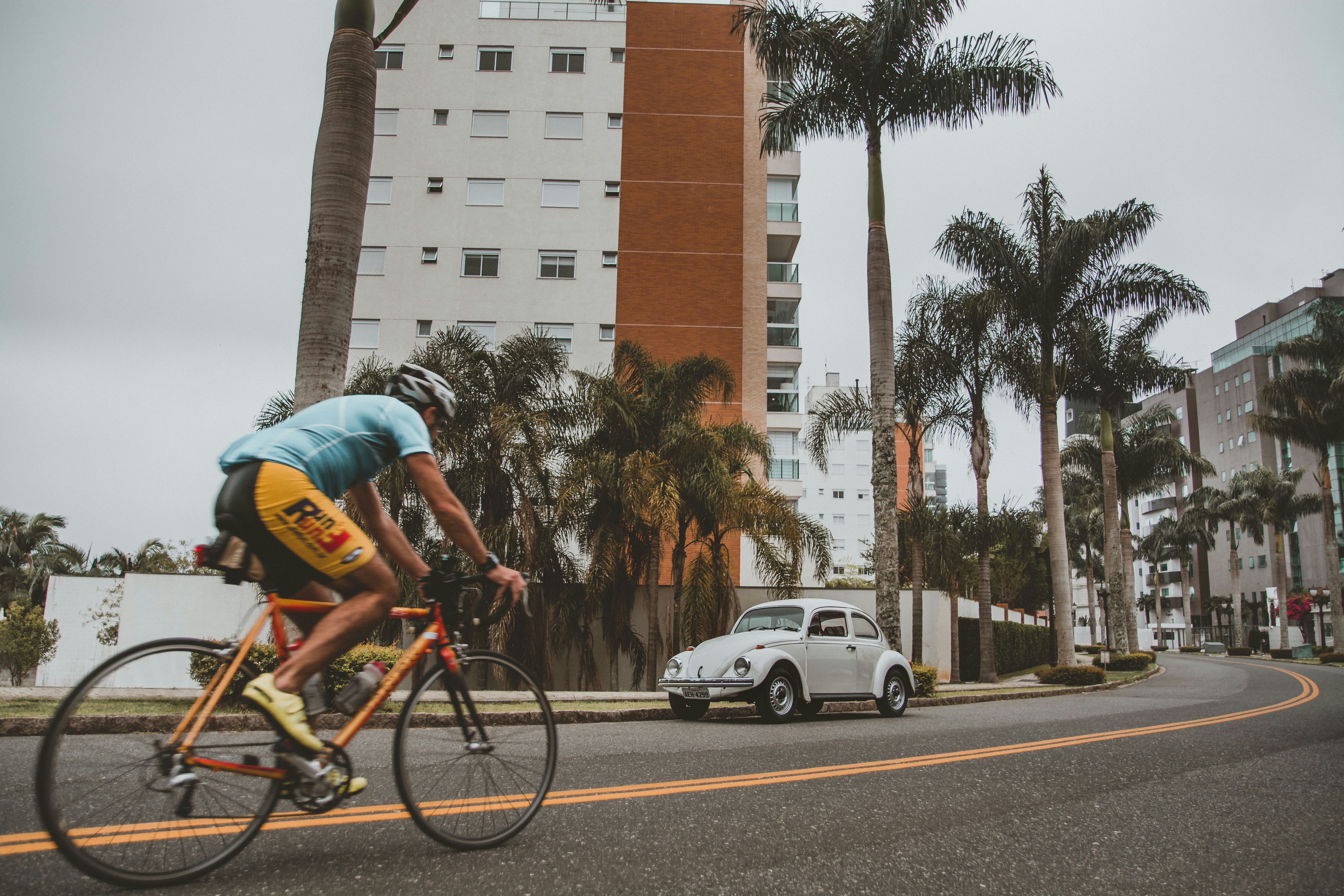 Cyclist riding a road bike outdoors in real conditions.