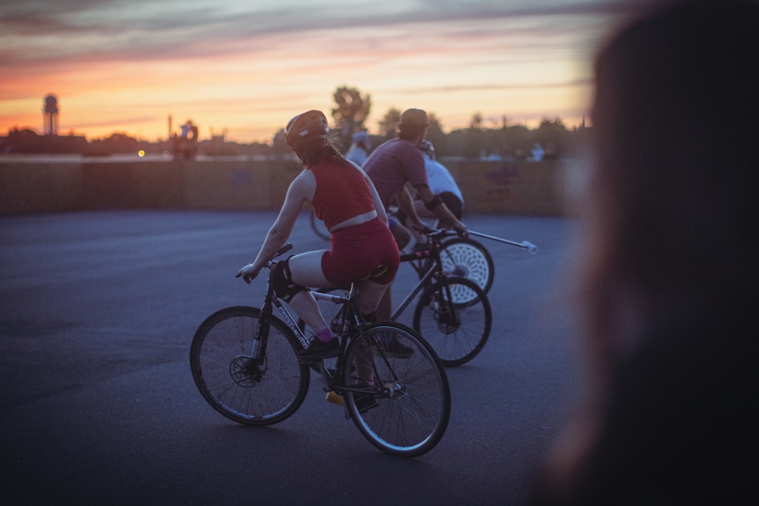Group of road cyclists riding together outdoors on paved roads.