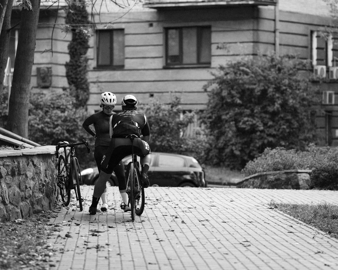 Group of road cyclists riding together outdoors on paved roads.