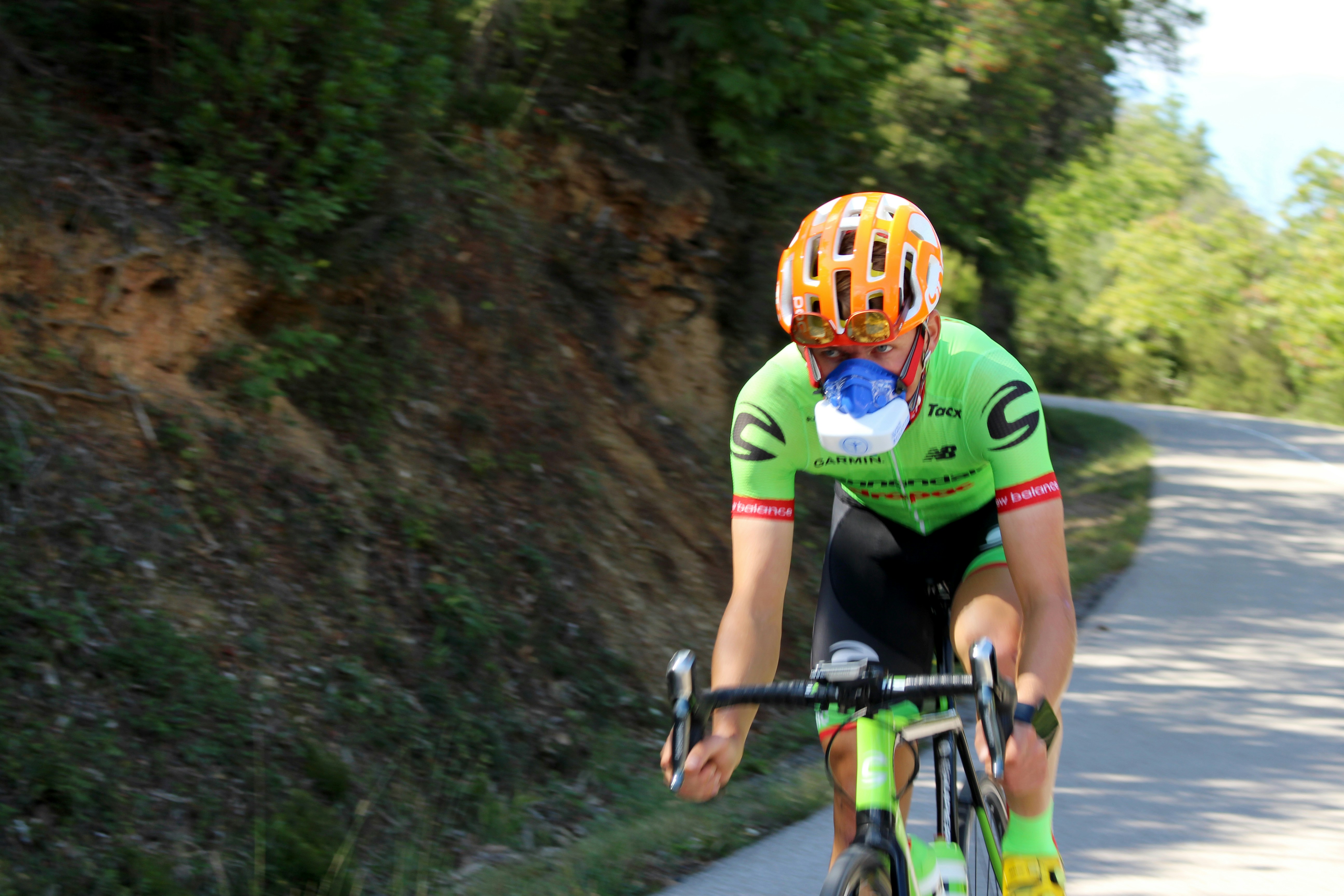Cyclist riding a road bike outdoors in real conditions.