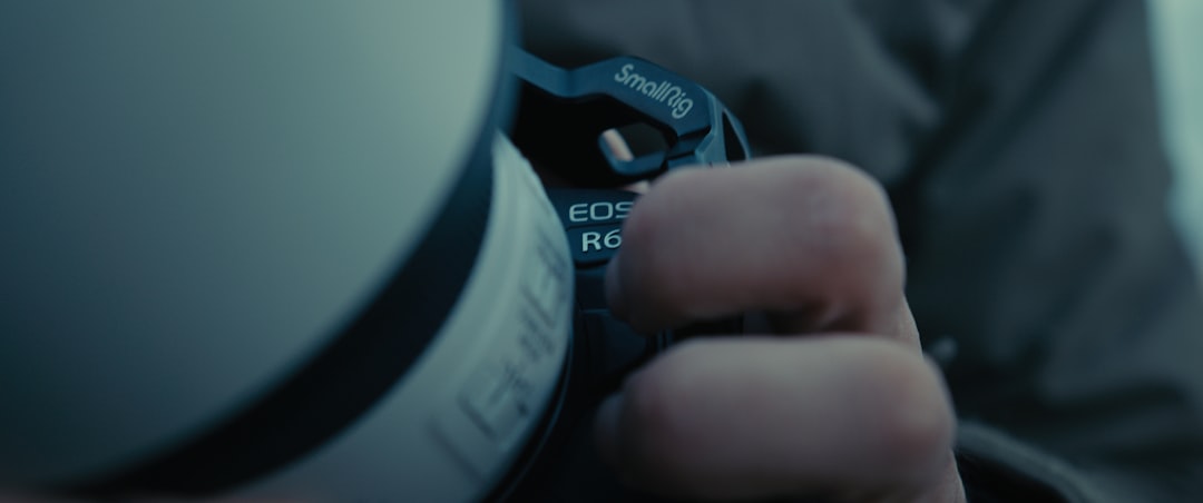 Close-up of a cyclist pedaling on a road bike with a power meter visible.