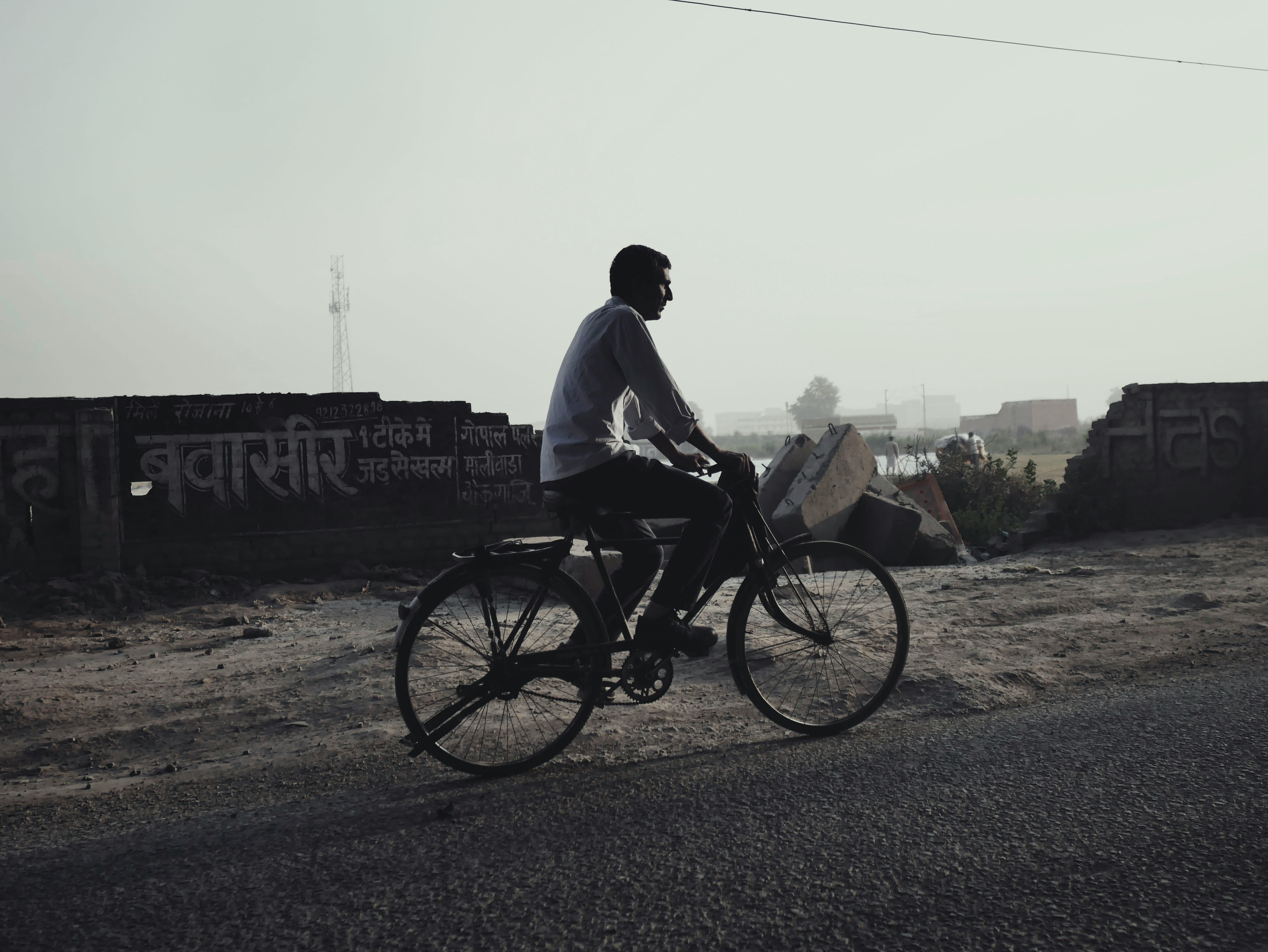 Cyclist riding a road bike outdoors in real conditions.