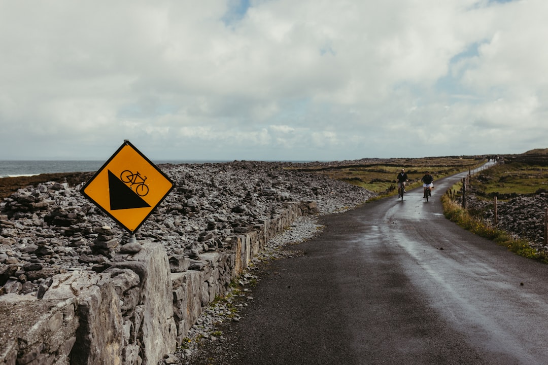 Group of road cyclists riding together outdoors on paved roads.