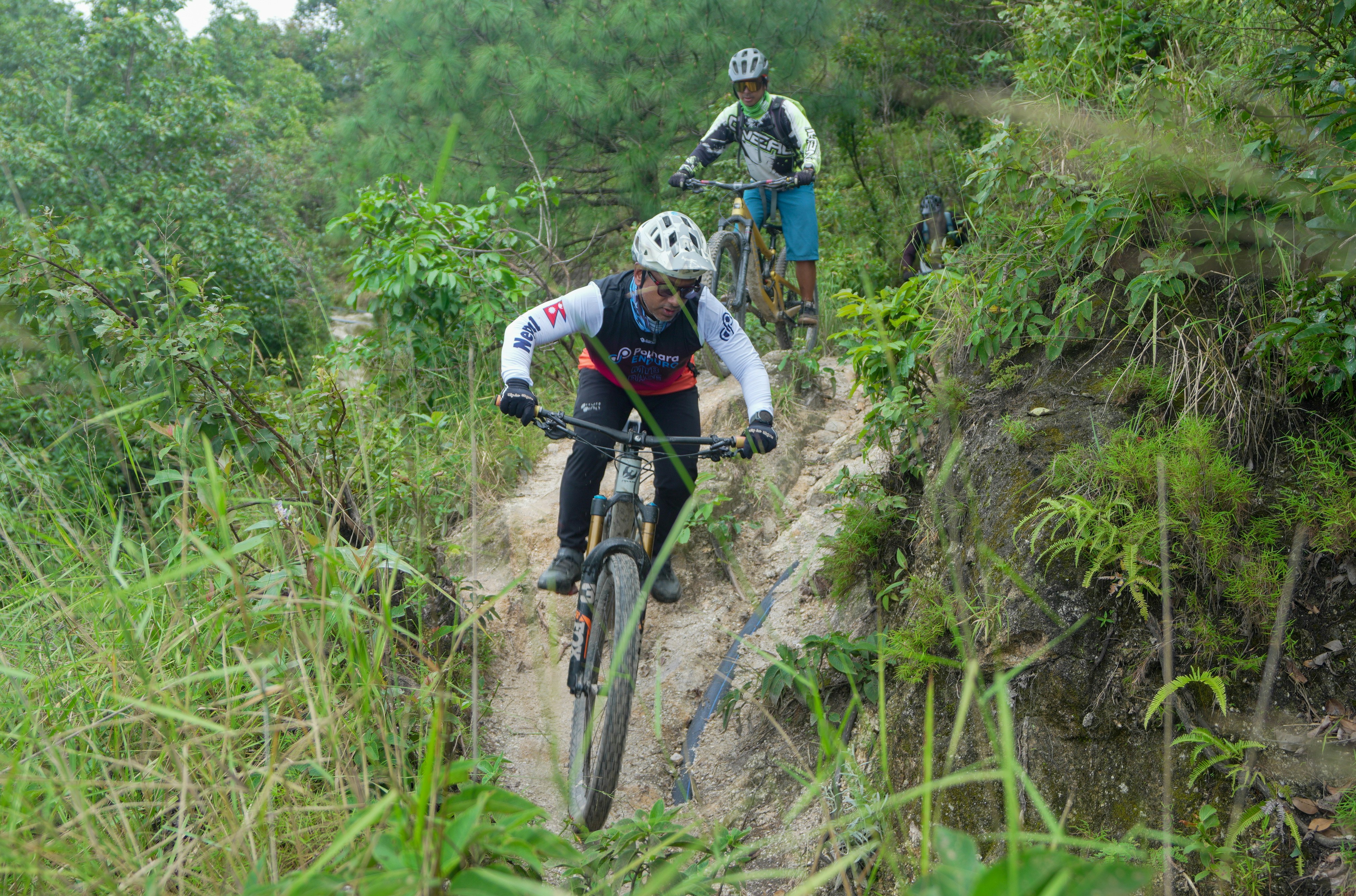 Cyclist riding a road bike outdoors in real conditions.