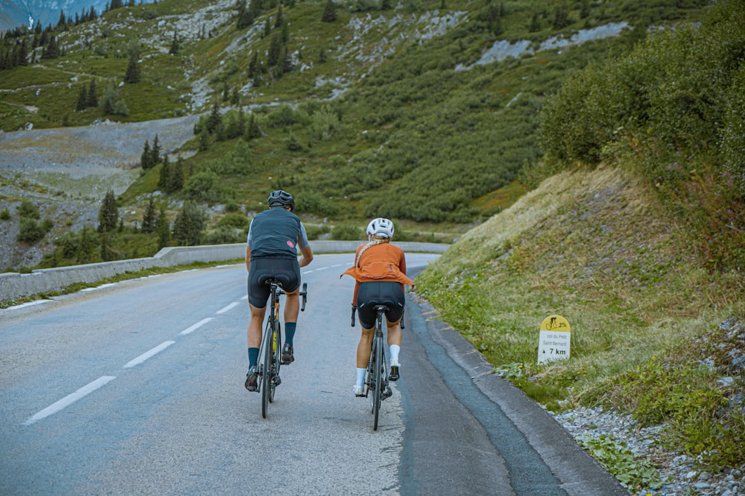 Group of road cyclists riding together outdoors on paved roads.