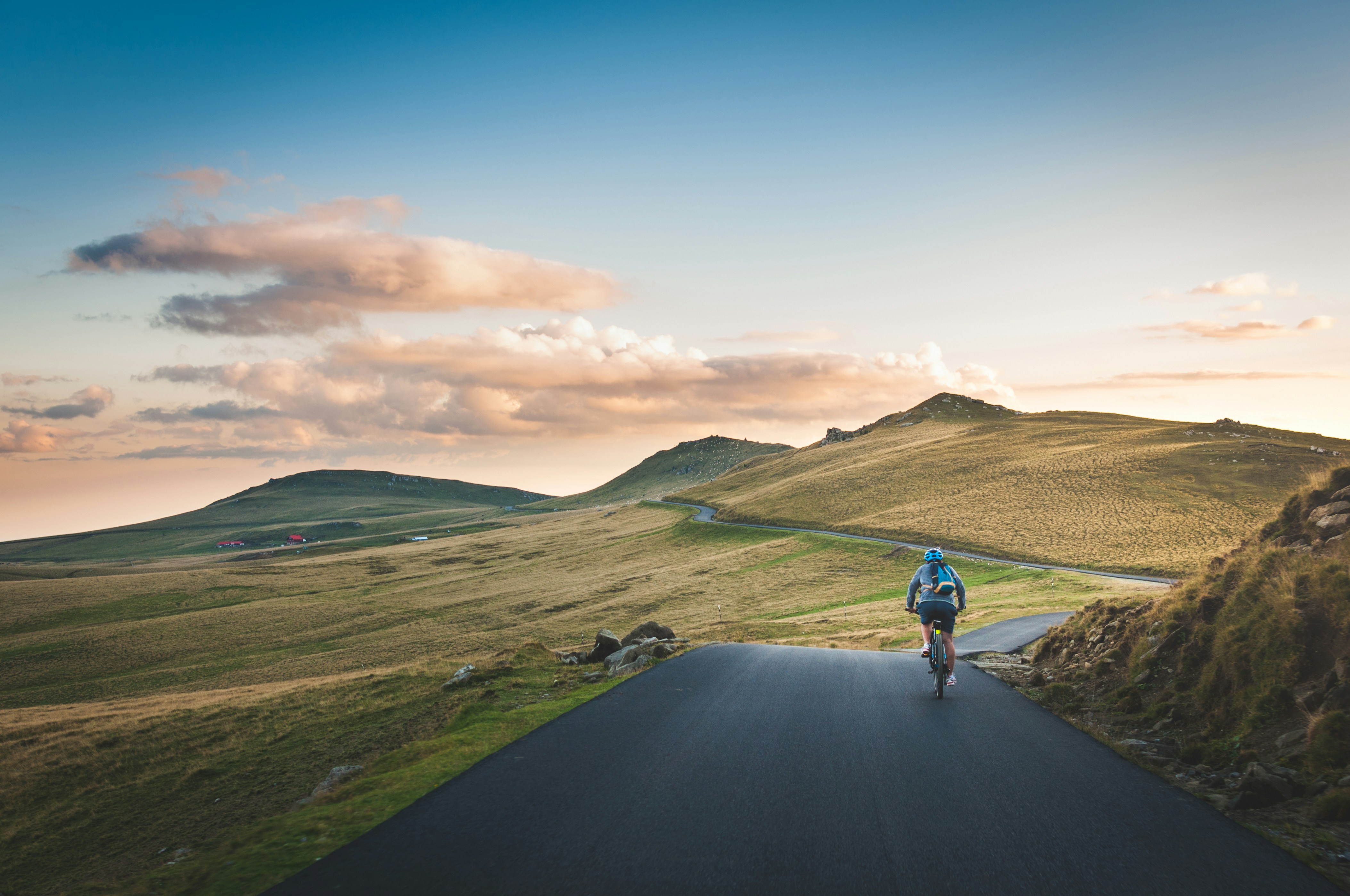 Cyclist riding a road bike outdoors in real conditions.