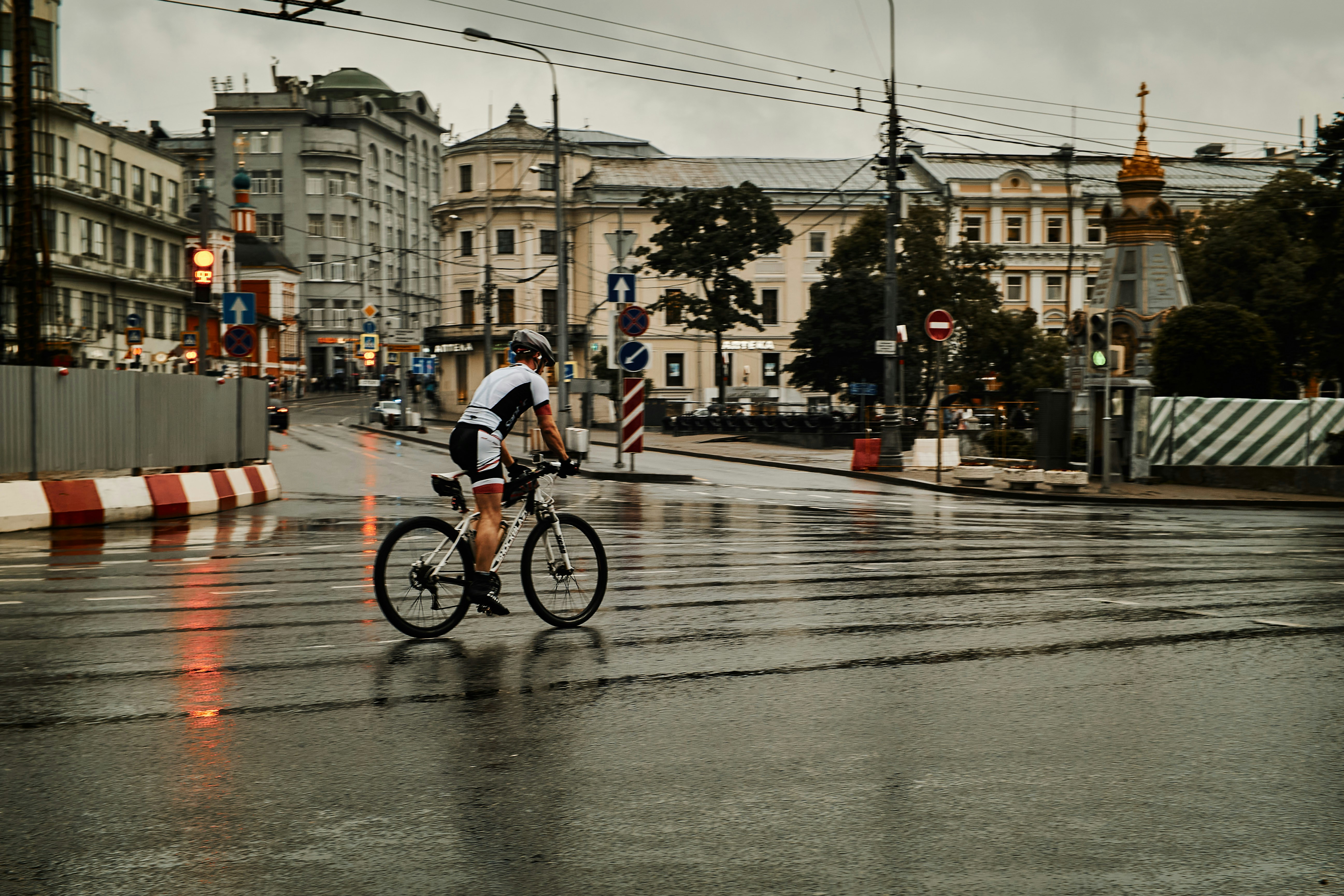 Cyclist riding a road bike outdoors in real conditions.