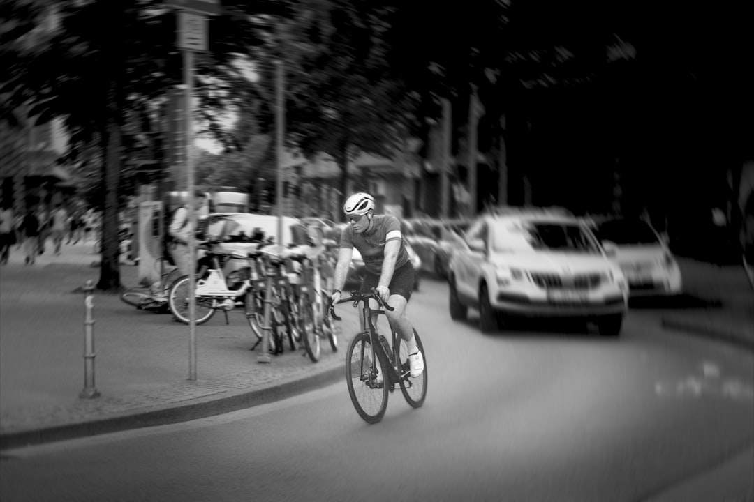 Group of road cyclists riding together outdoors on paved roads.