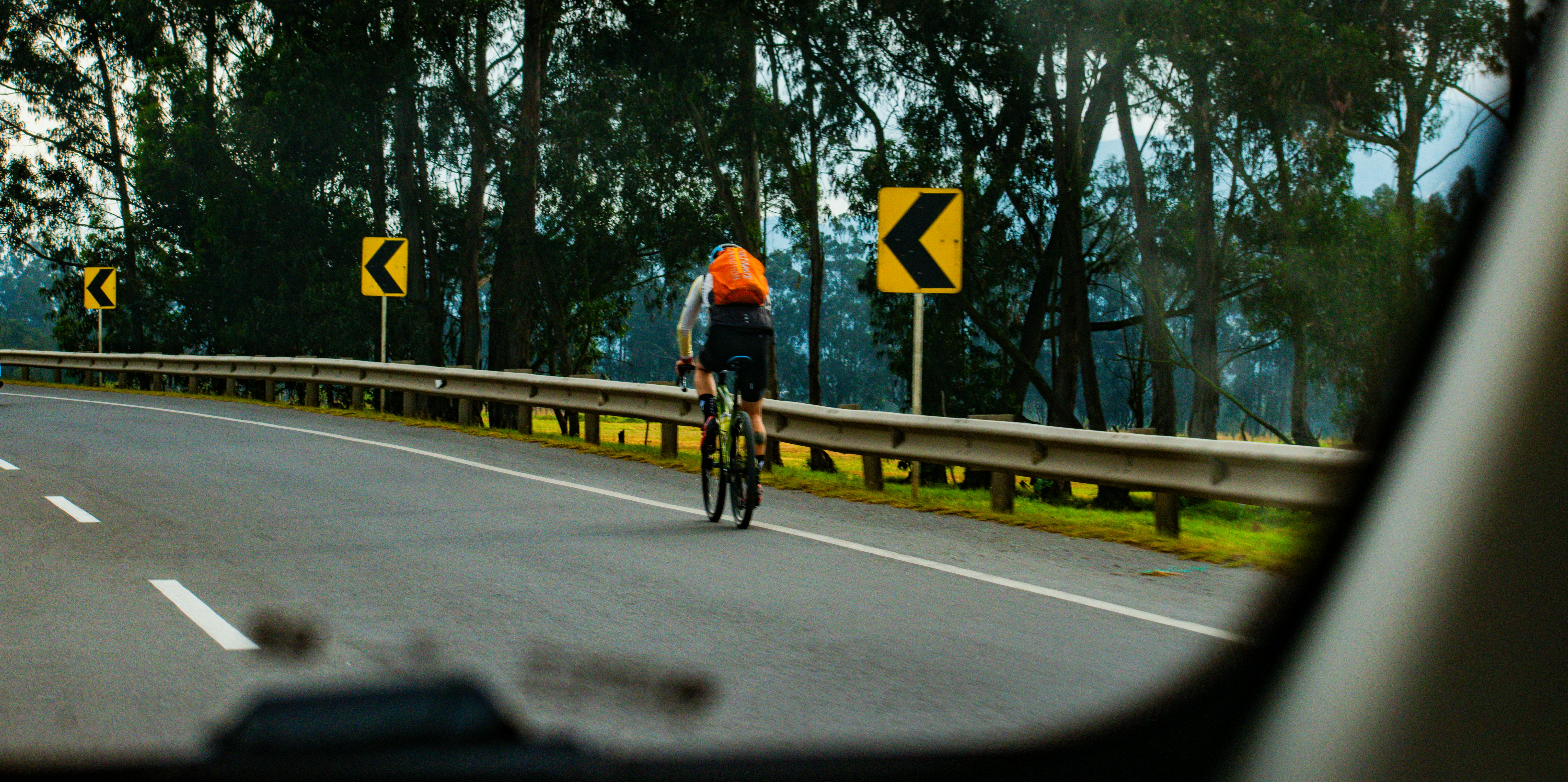 Cyclist riding a road bike outdoors in real conditions.