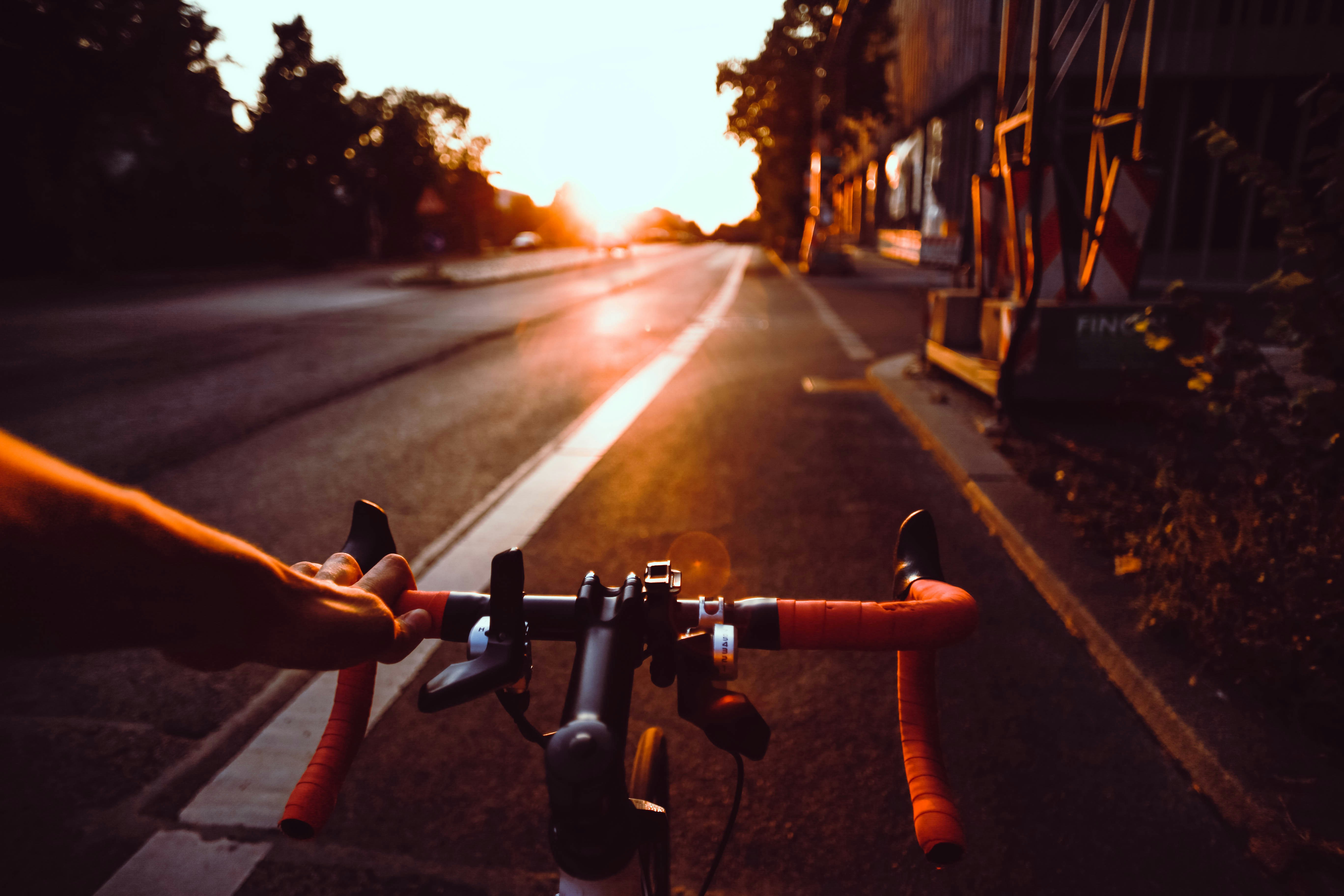 Cyclist riding a road bike outdoors in real conditions.