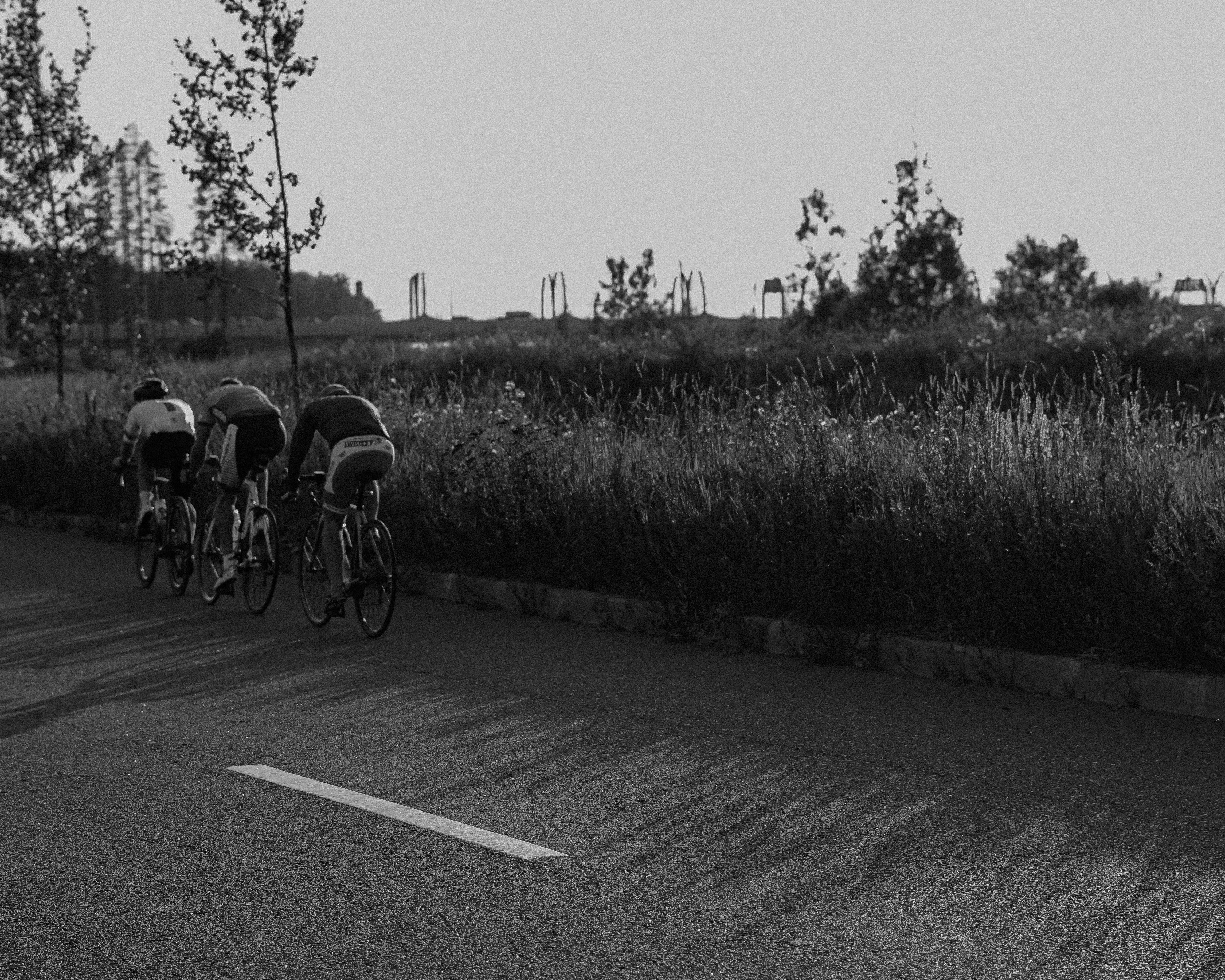 Cyclist riding a road bike outdoors in real conditions.