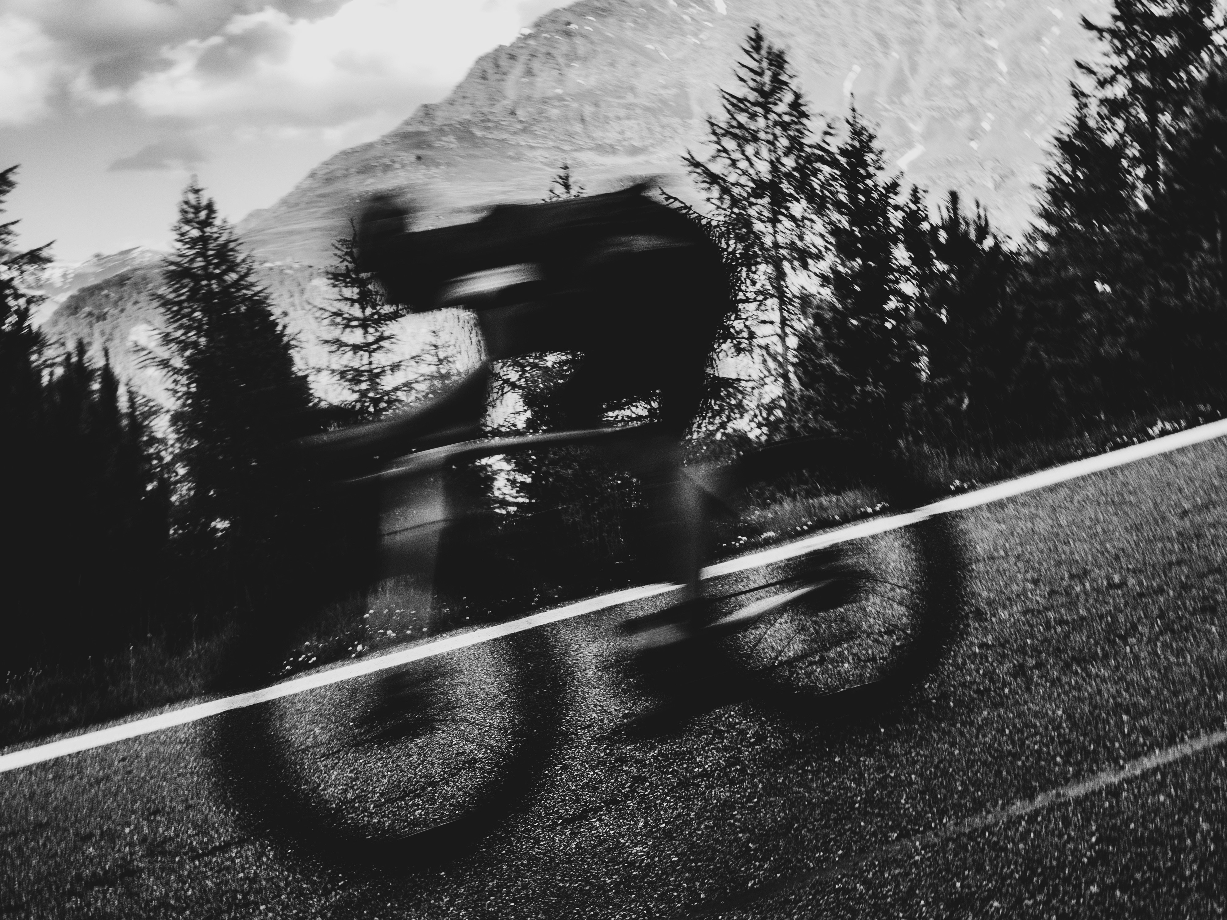 Cyclist riding a road bike outdoors in real conditions.