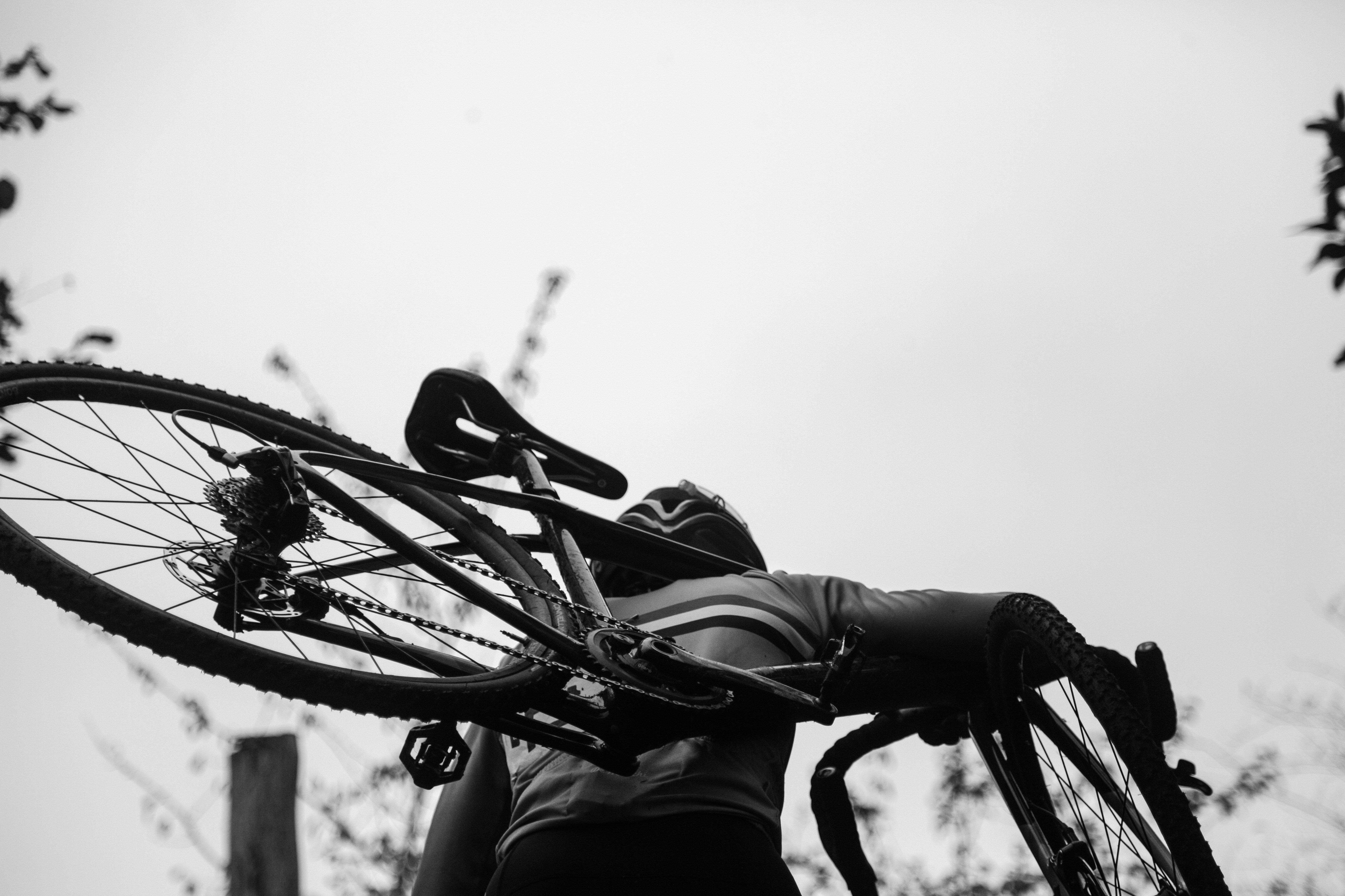Cyclist riding a road bike outdoors in real conditions.