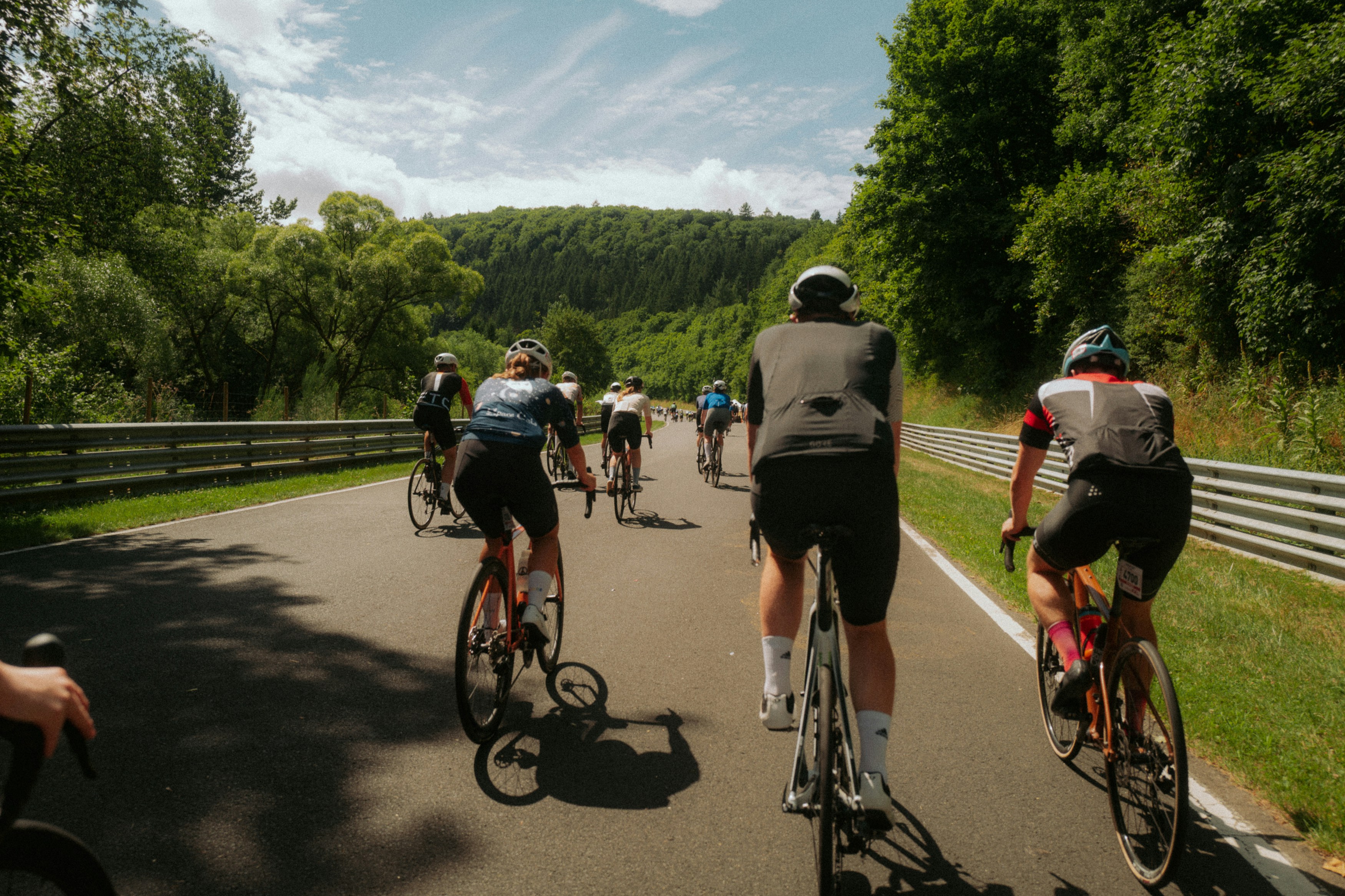 Cyclist riding a road bike outdoors in real conditions.