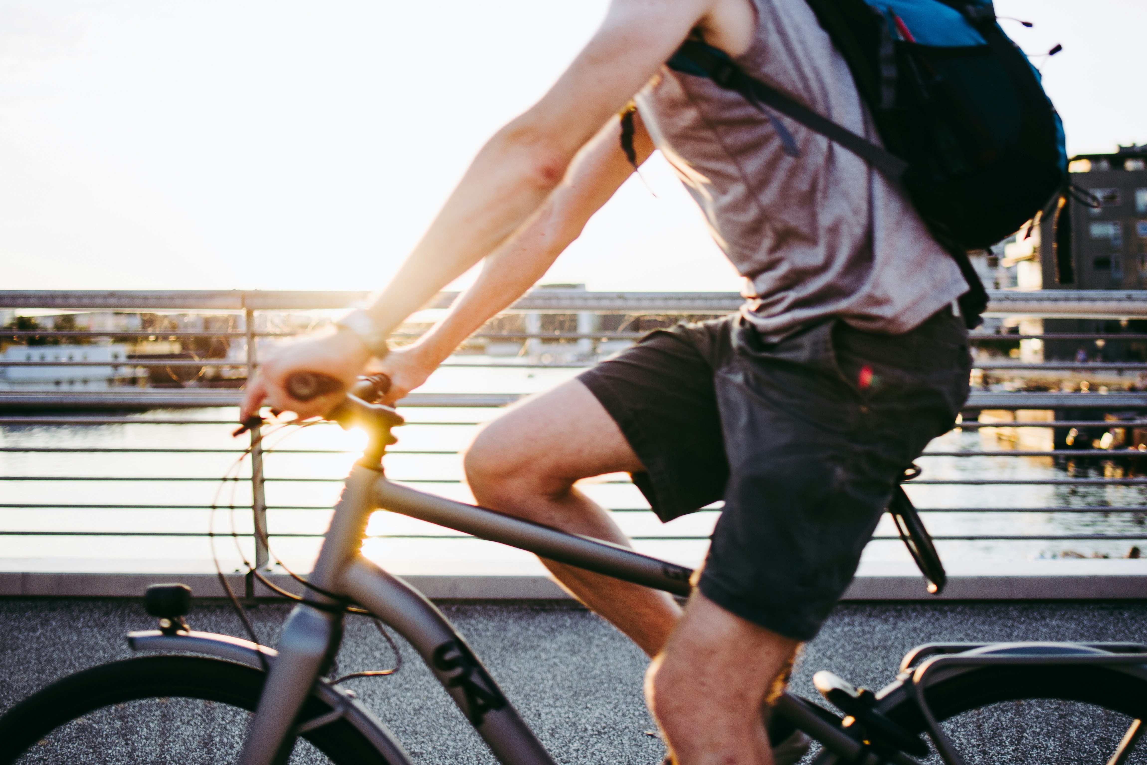 Cyclist riding a road bike outdoors in real conditions.