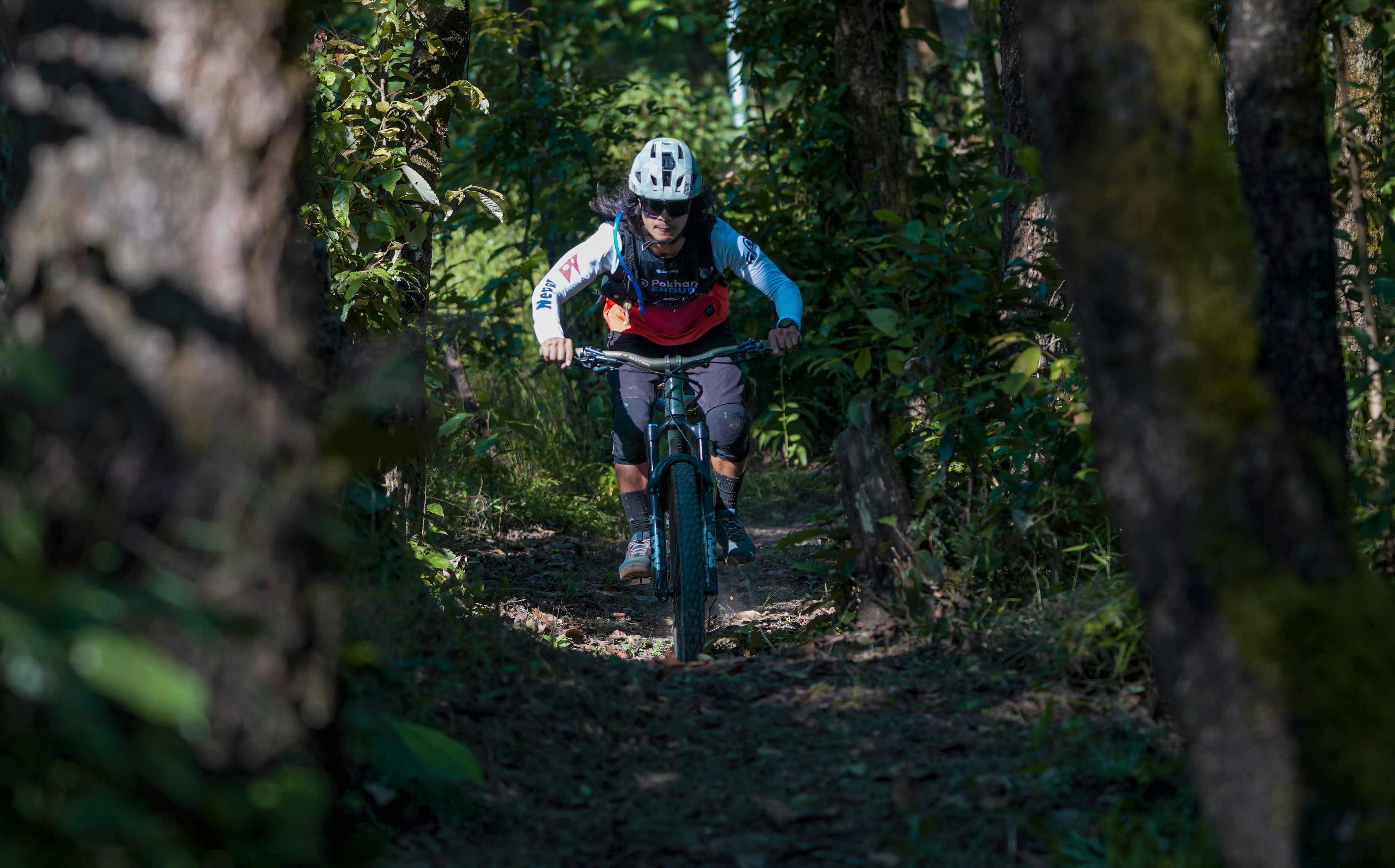 Cyclist riding a road bike outdoors in real conditions.