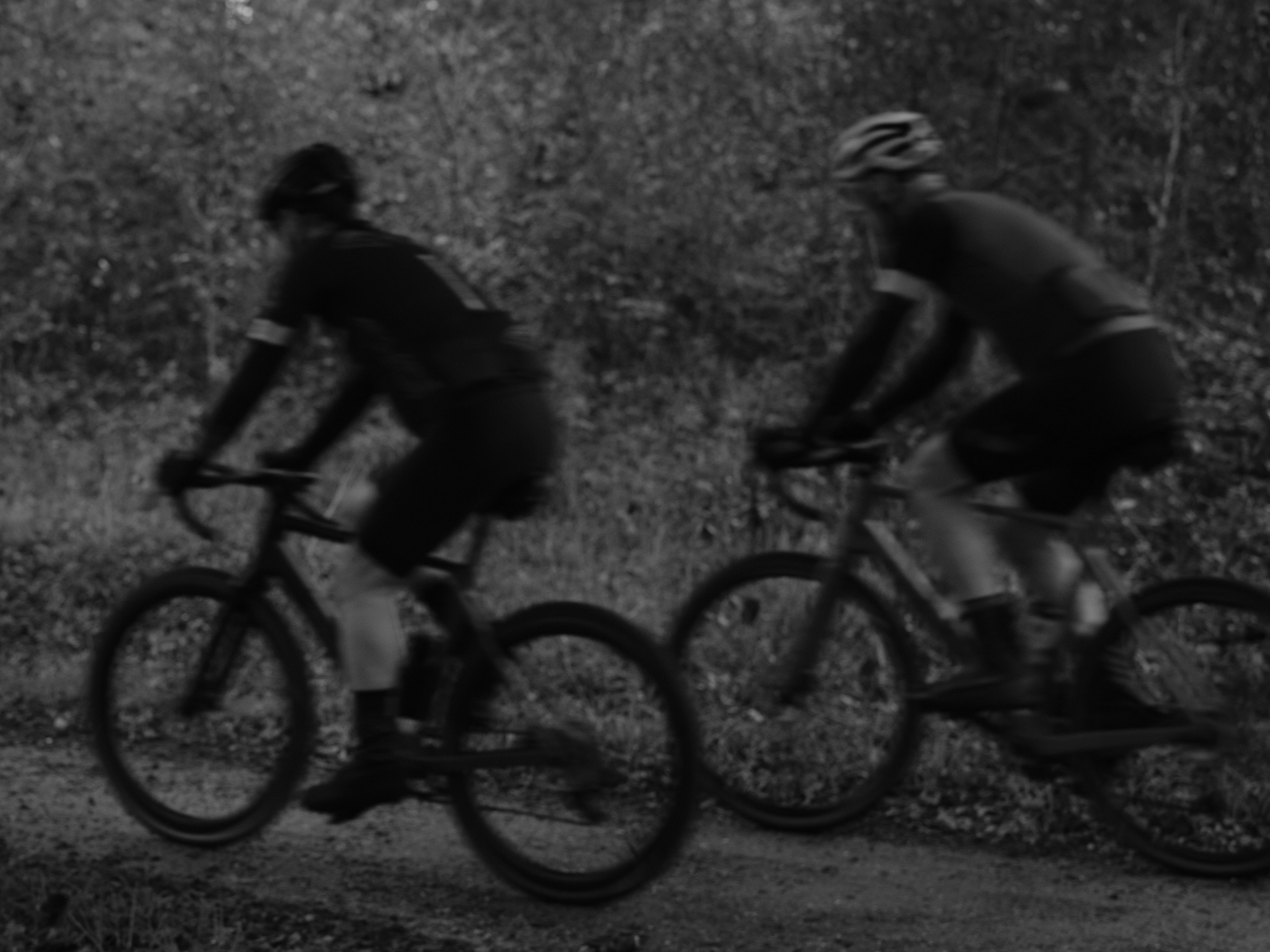 Cyclist riding a road bike outdoors in real conditions.