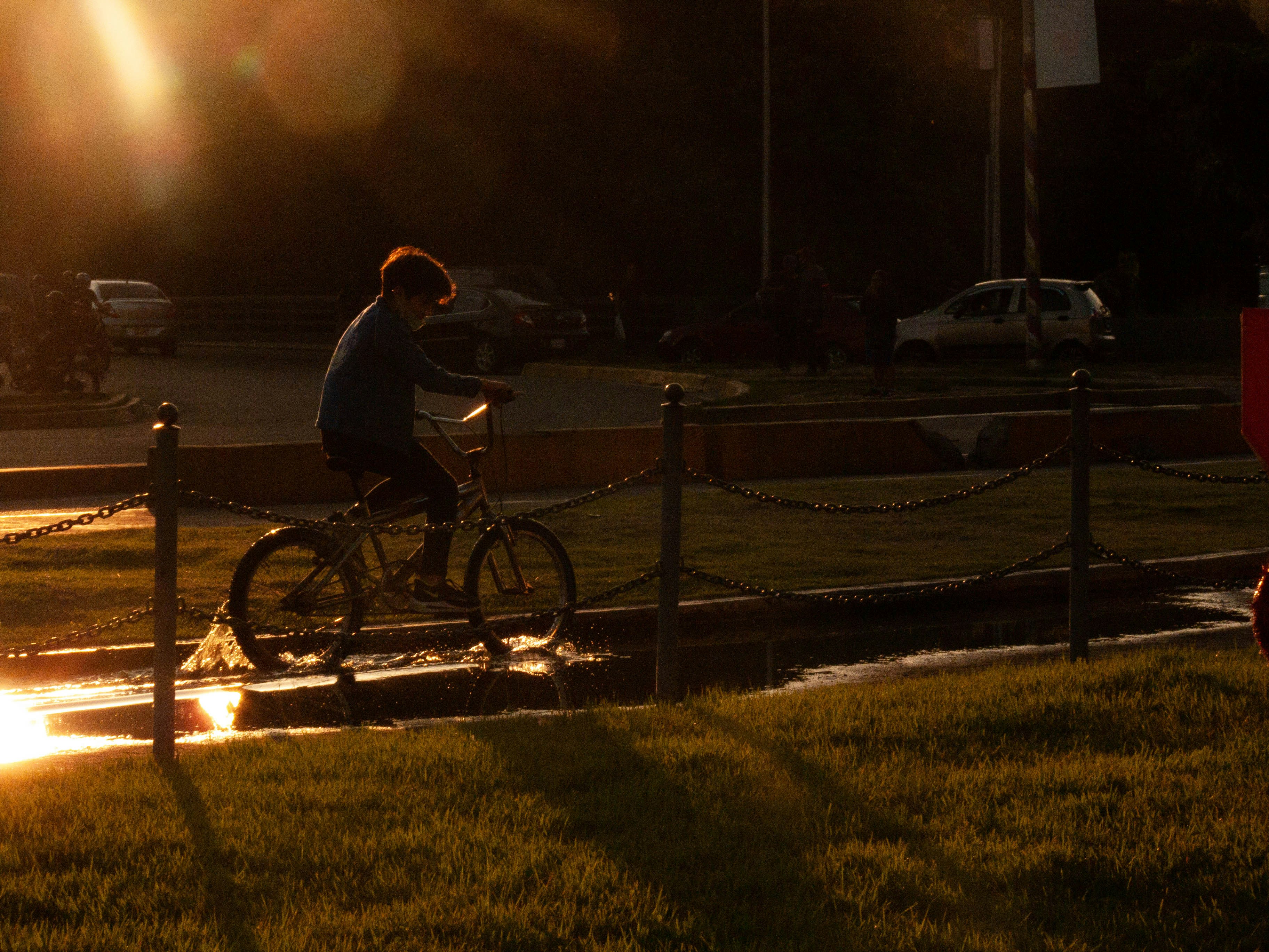 Cyclist riding a road bike outdoors in real conditions.