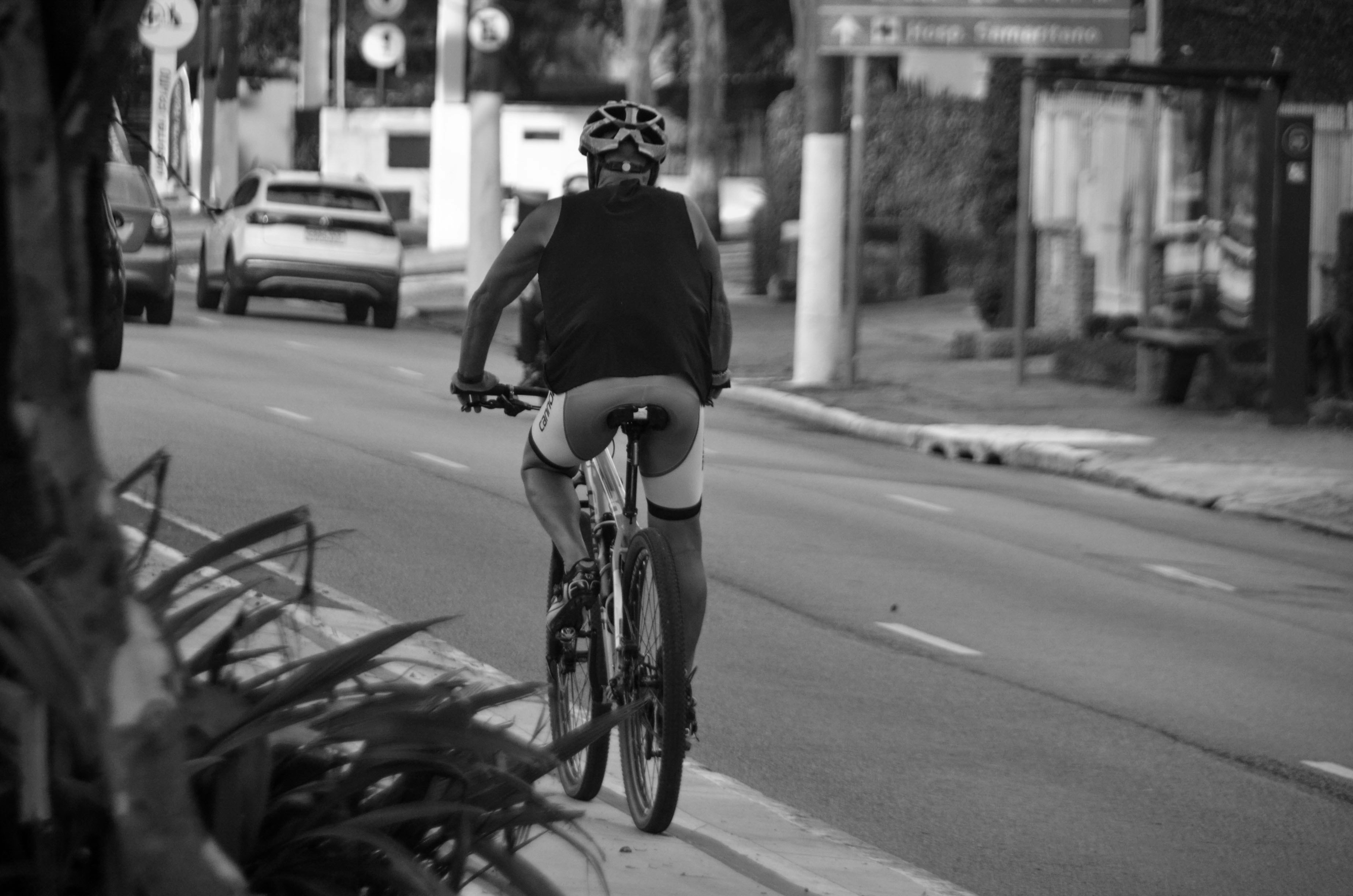 Cyclist riding a road bike outdoors in real conditions.