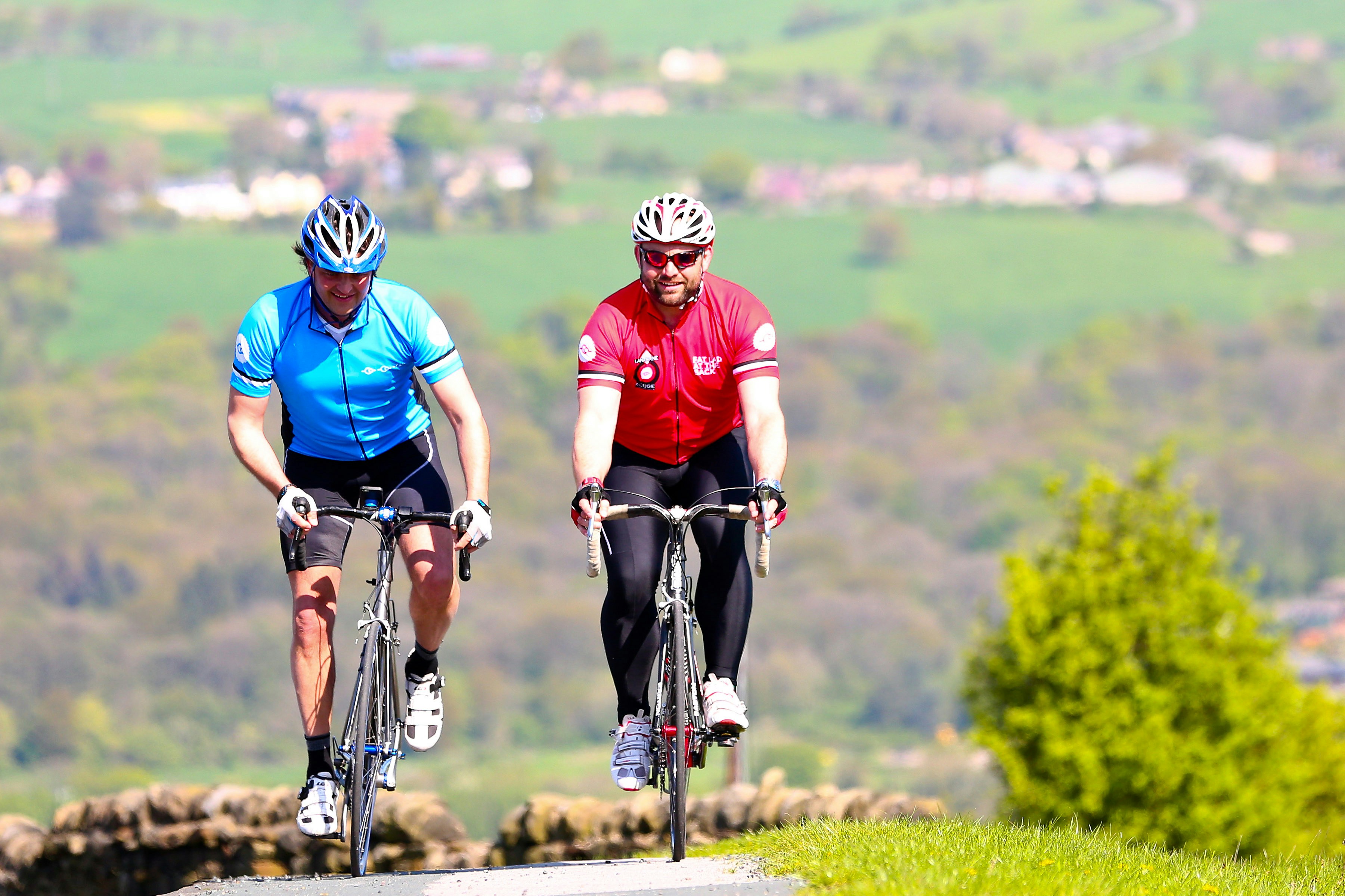 Cyclist riding a road bike outdoors in real conditions.