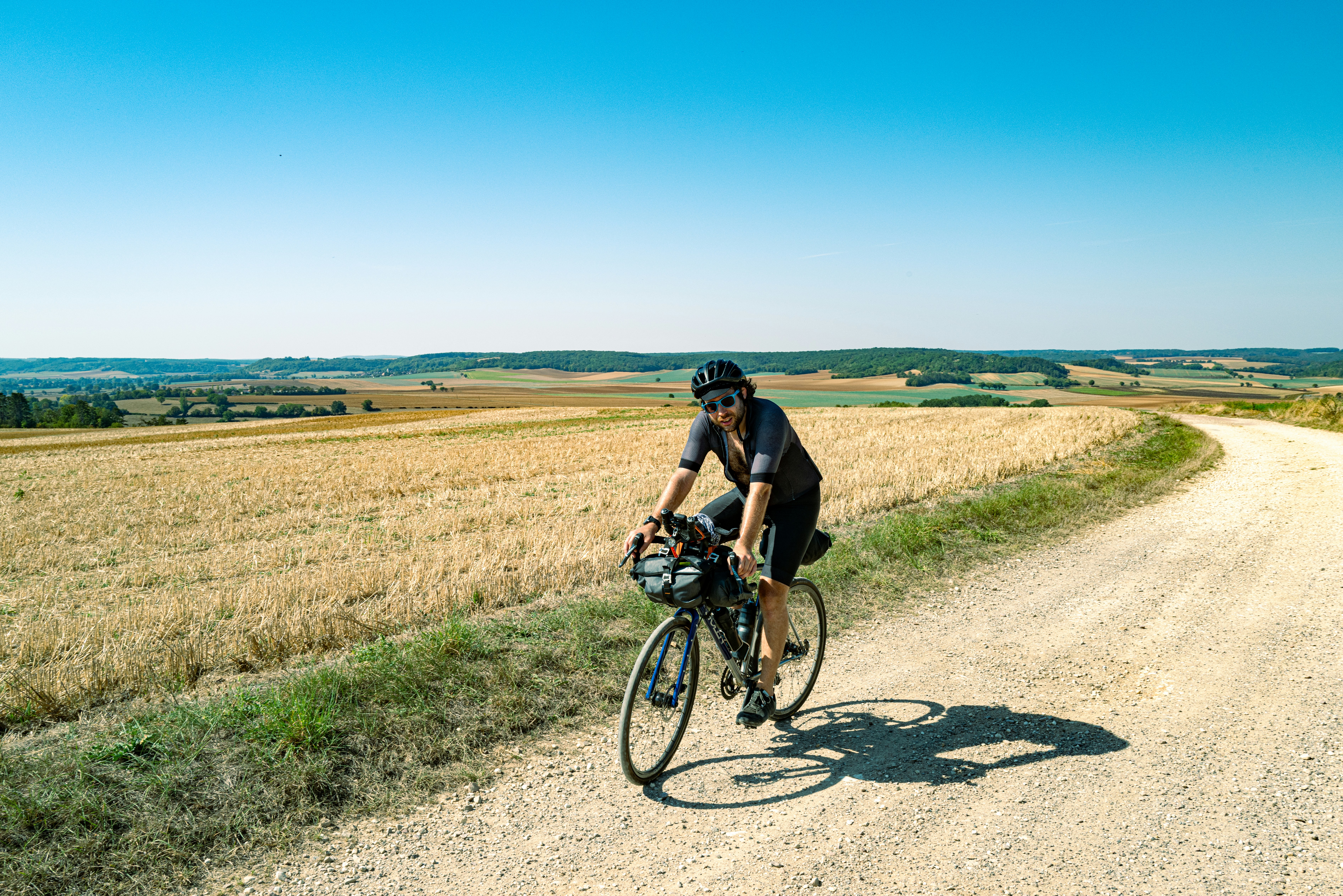 Cyclist riding a road bike outdoors in real conditions.